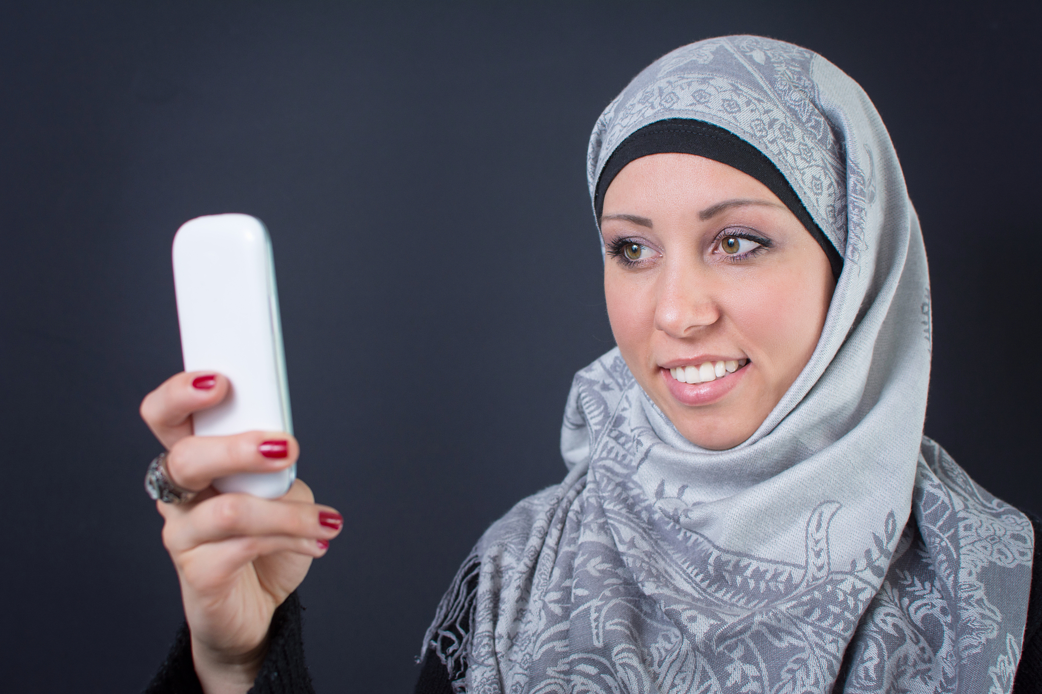 muslim woman in hijab making a selfie