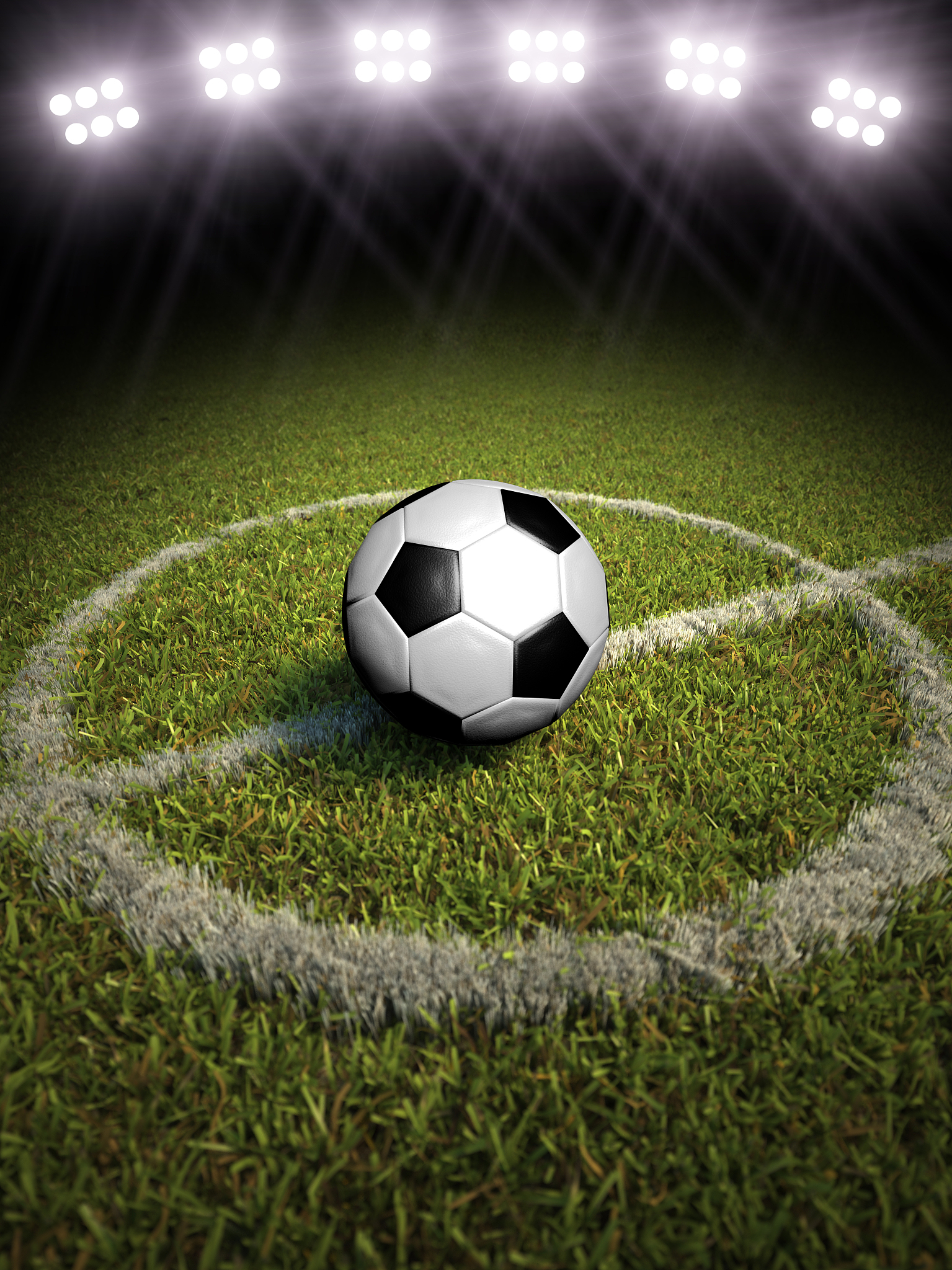 soccer ball on a soccer field with stadium lighting