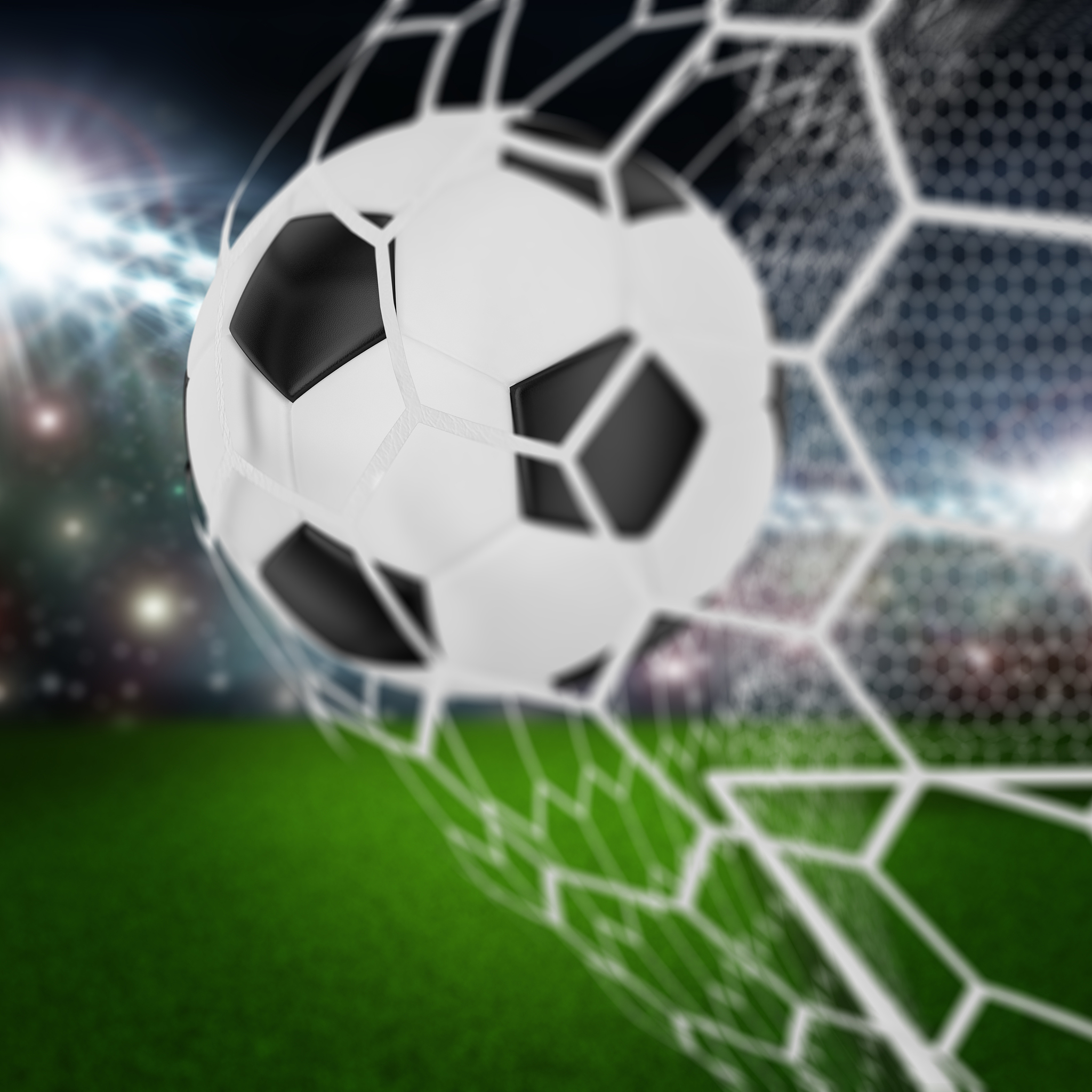 soccer ball in goal net