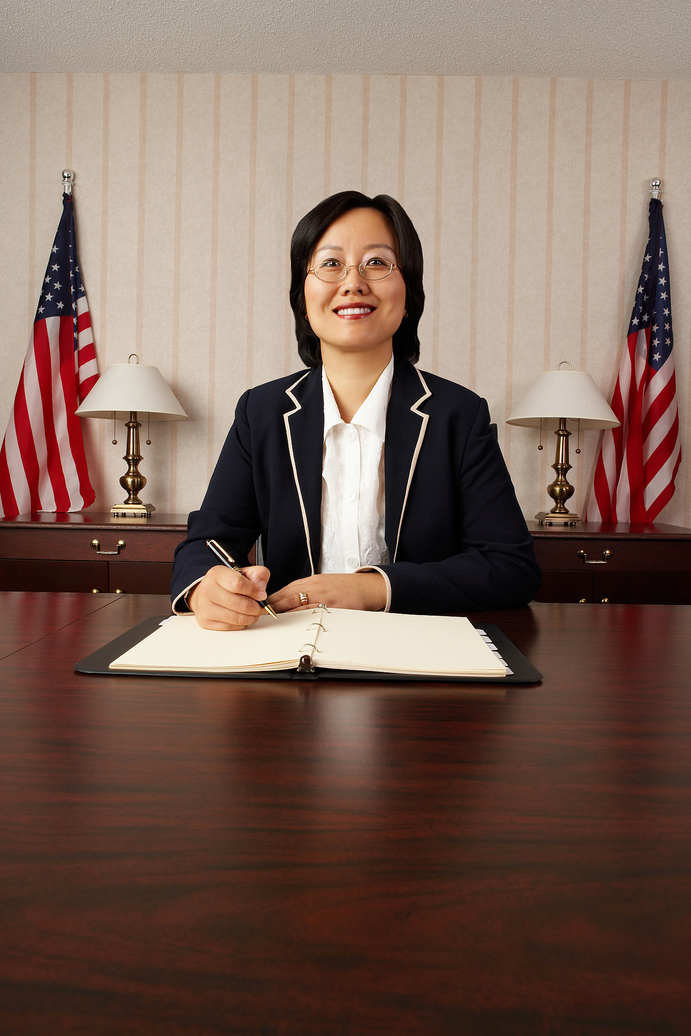 politician woman signing document