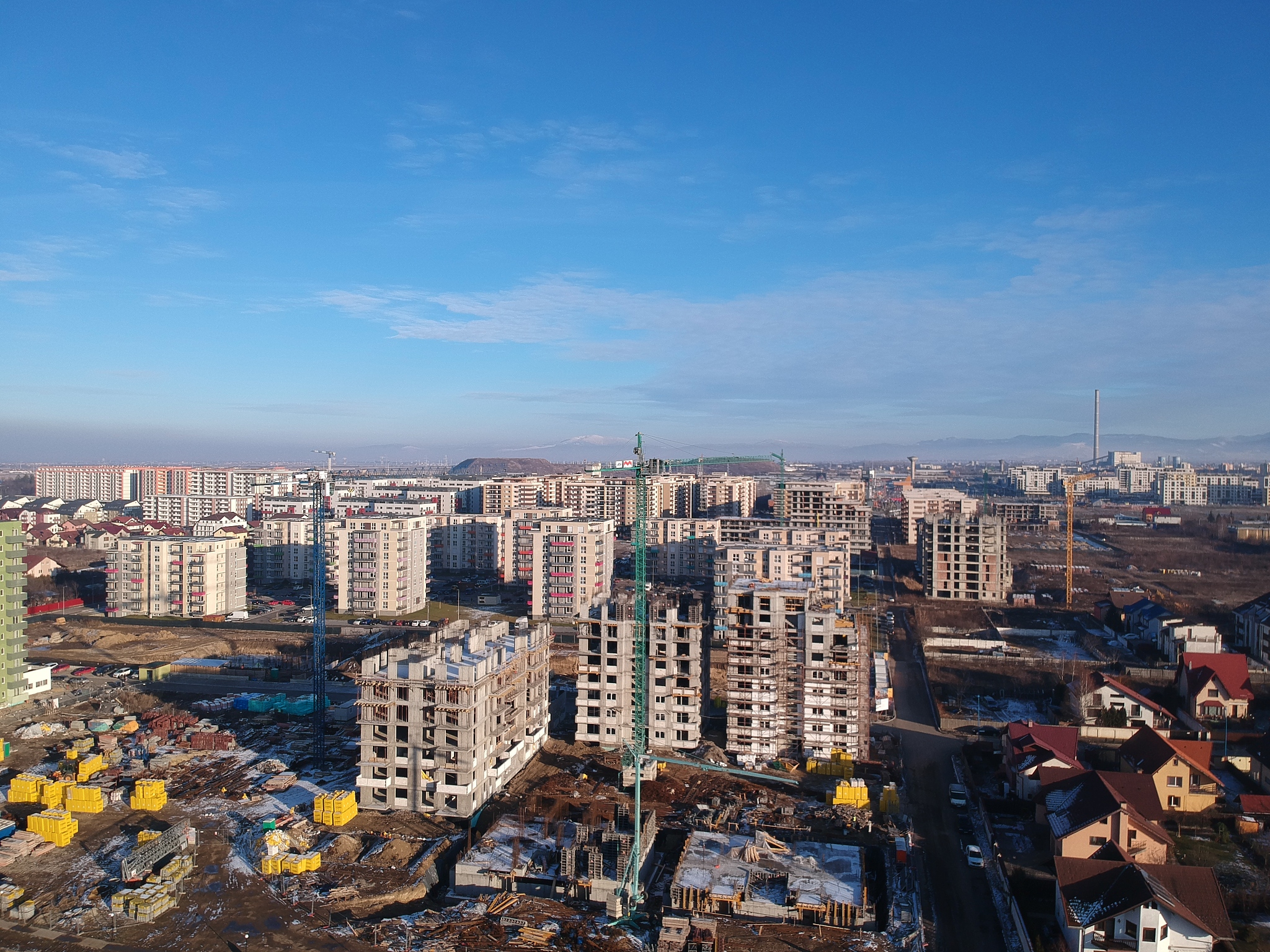high angle view of buildings in city against sky
