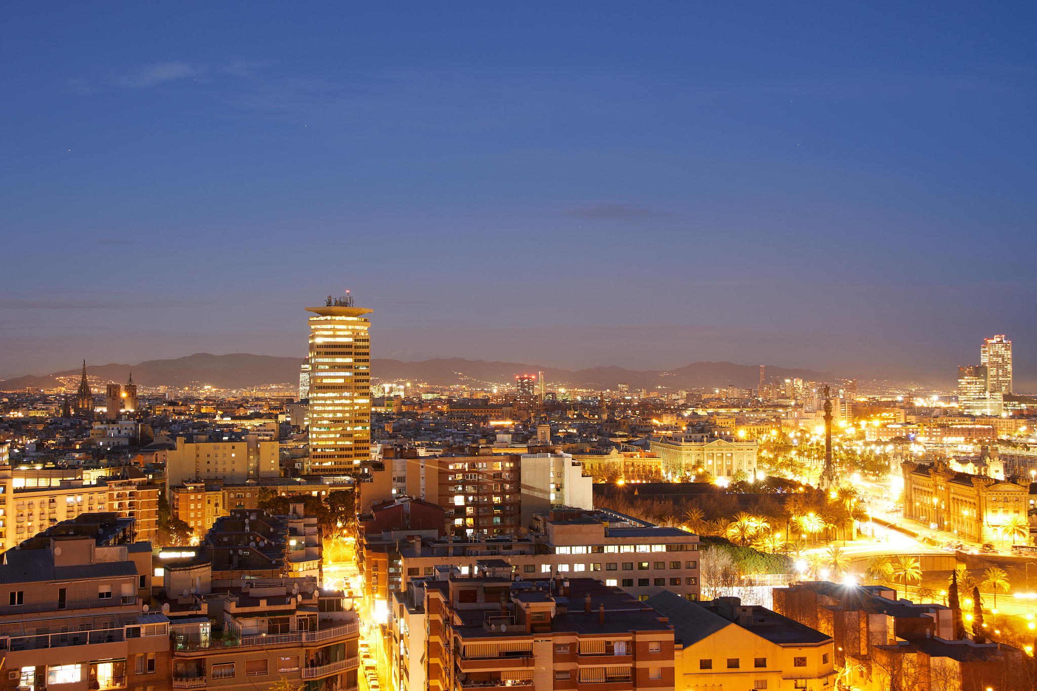 the skyline at night of barcelona, spain