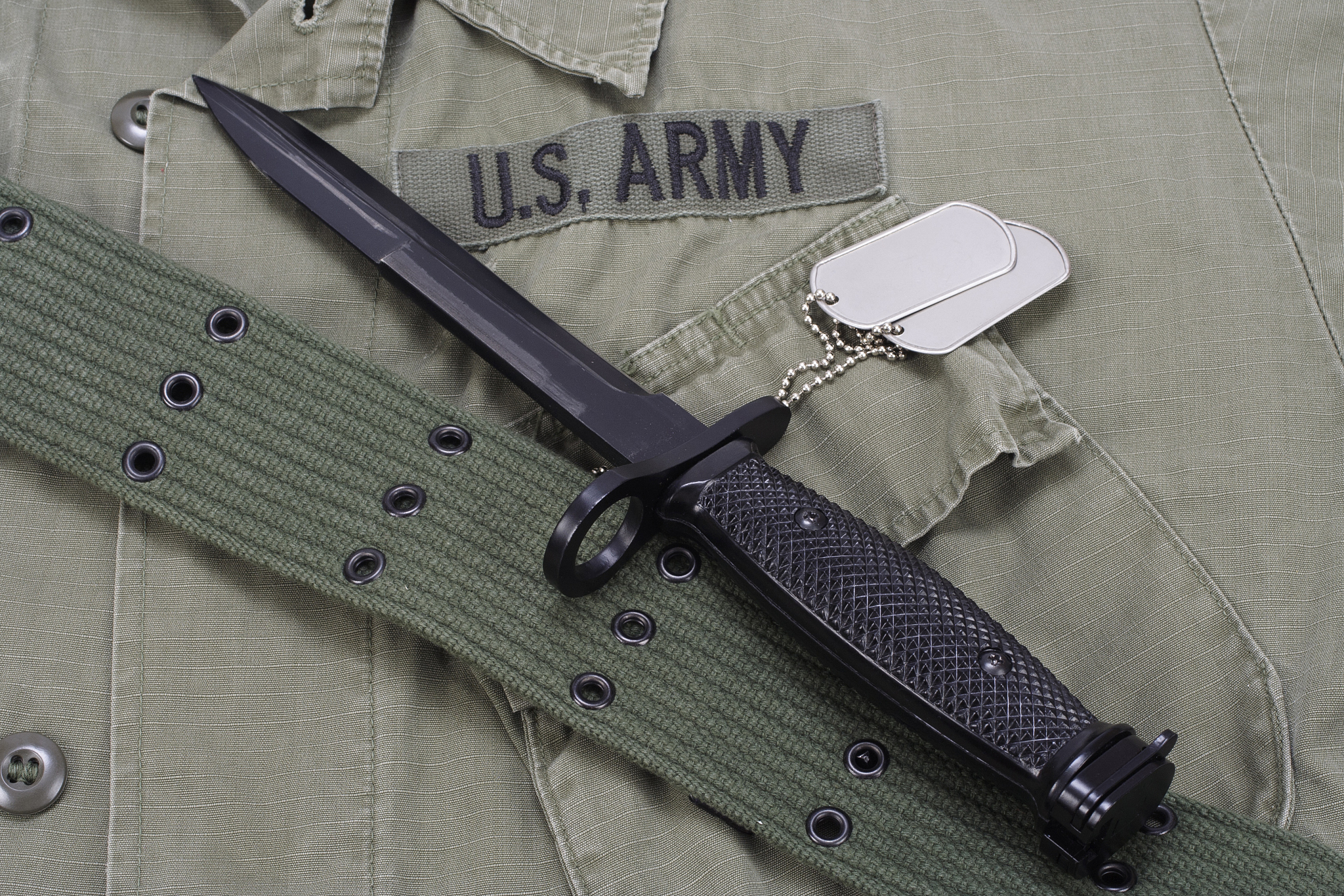 m16 rifle bayonet on uniform background