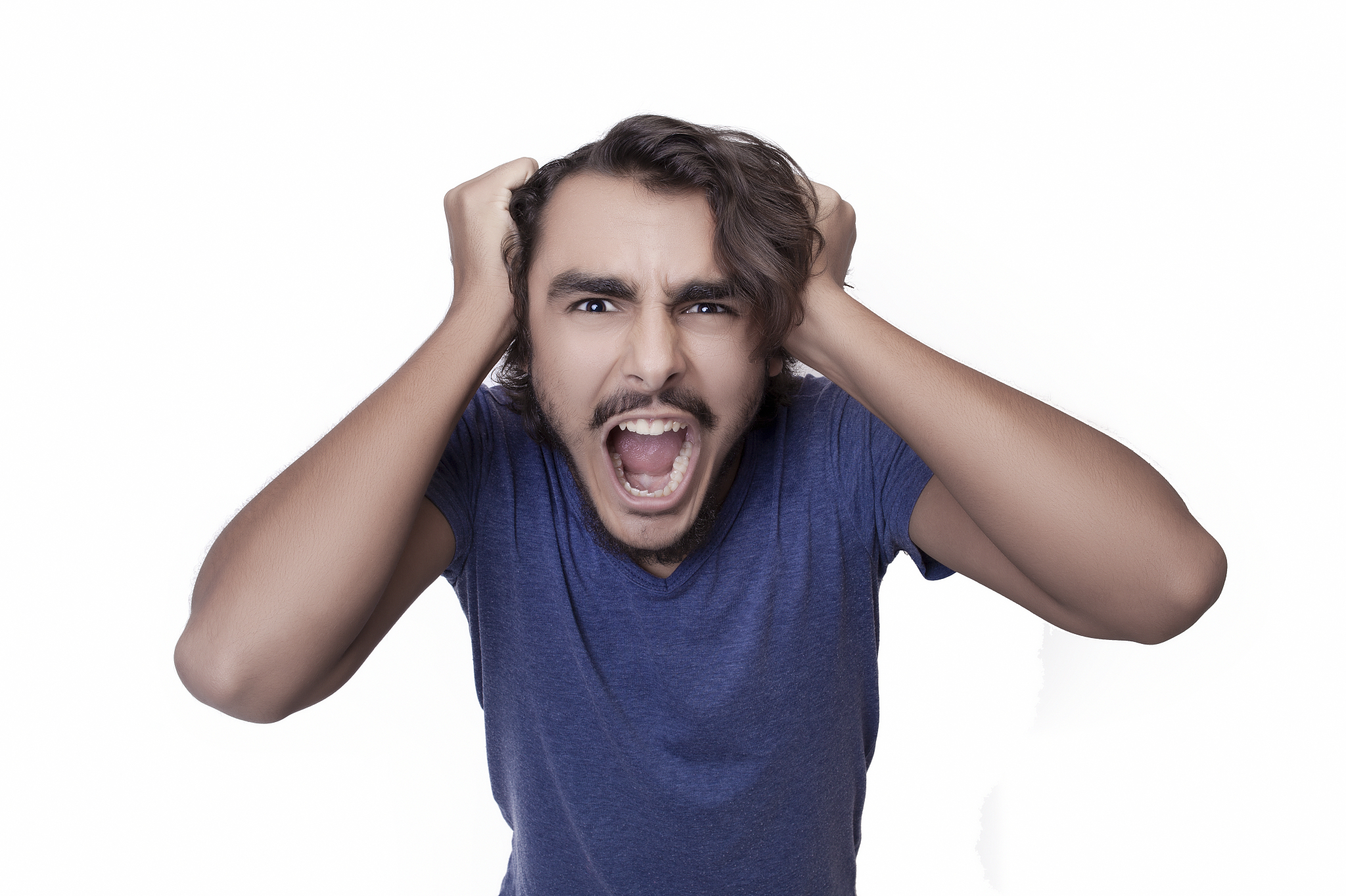 portrait of an angry man screaming in front of a white backgroun