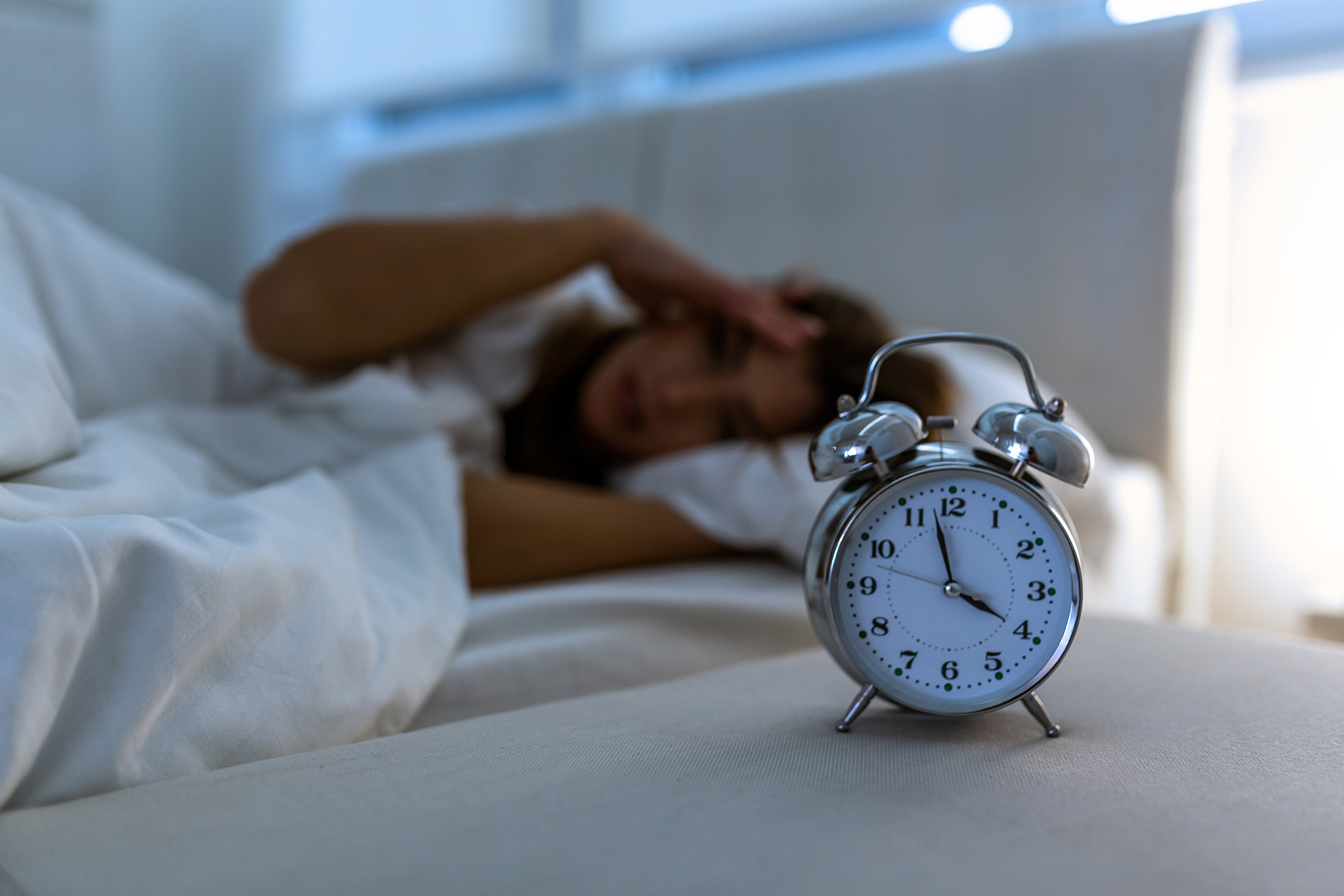 young beautiful woman at home bedroom lying in bed late at night