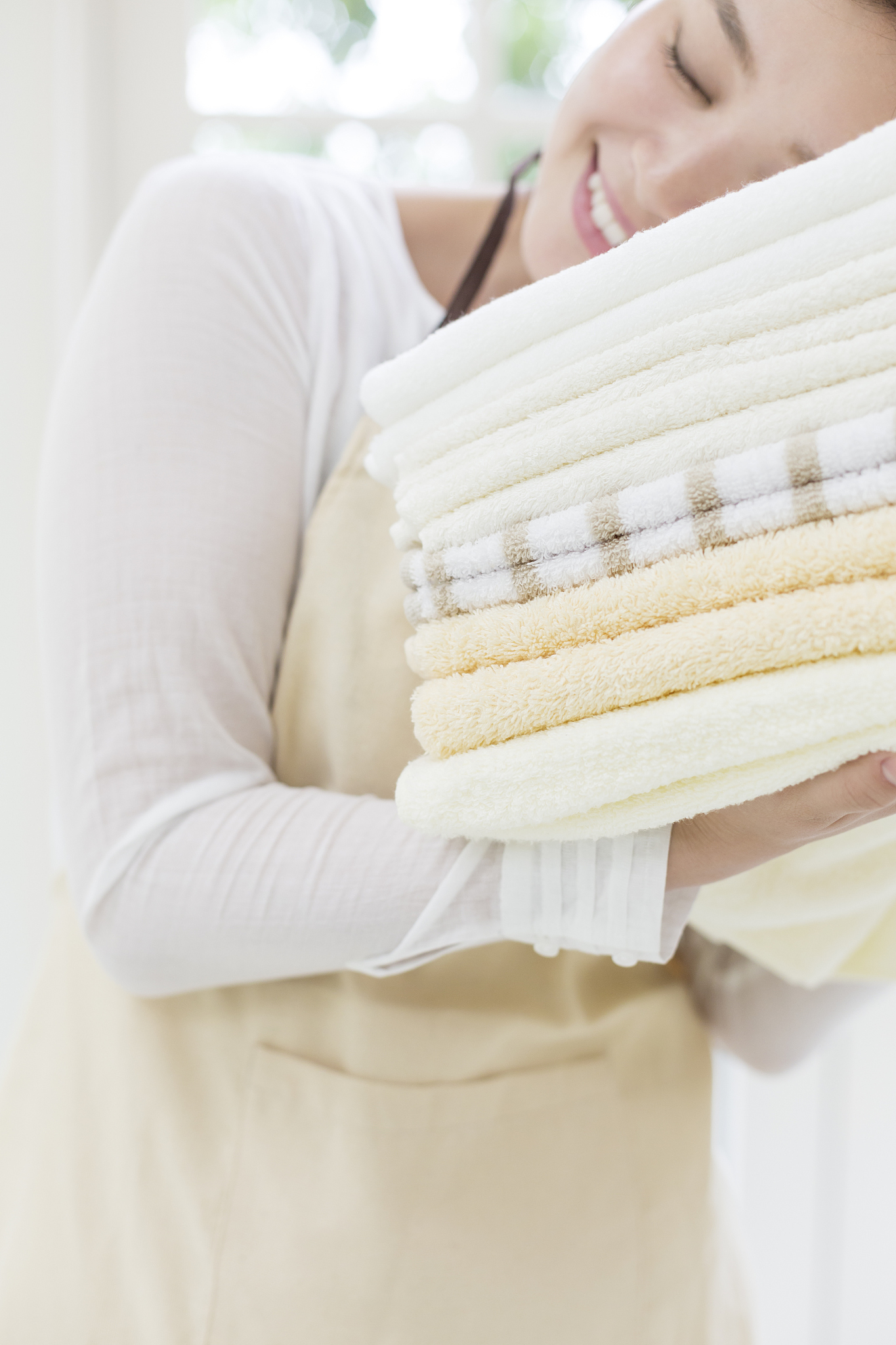 close-up of woman holding fresh towels