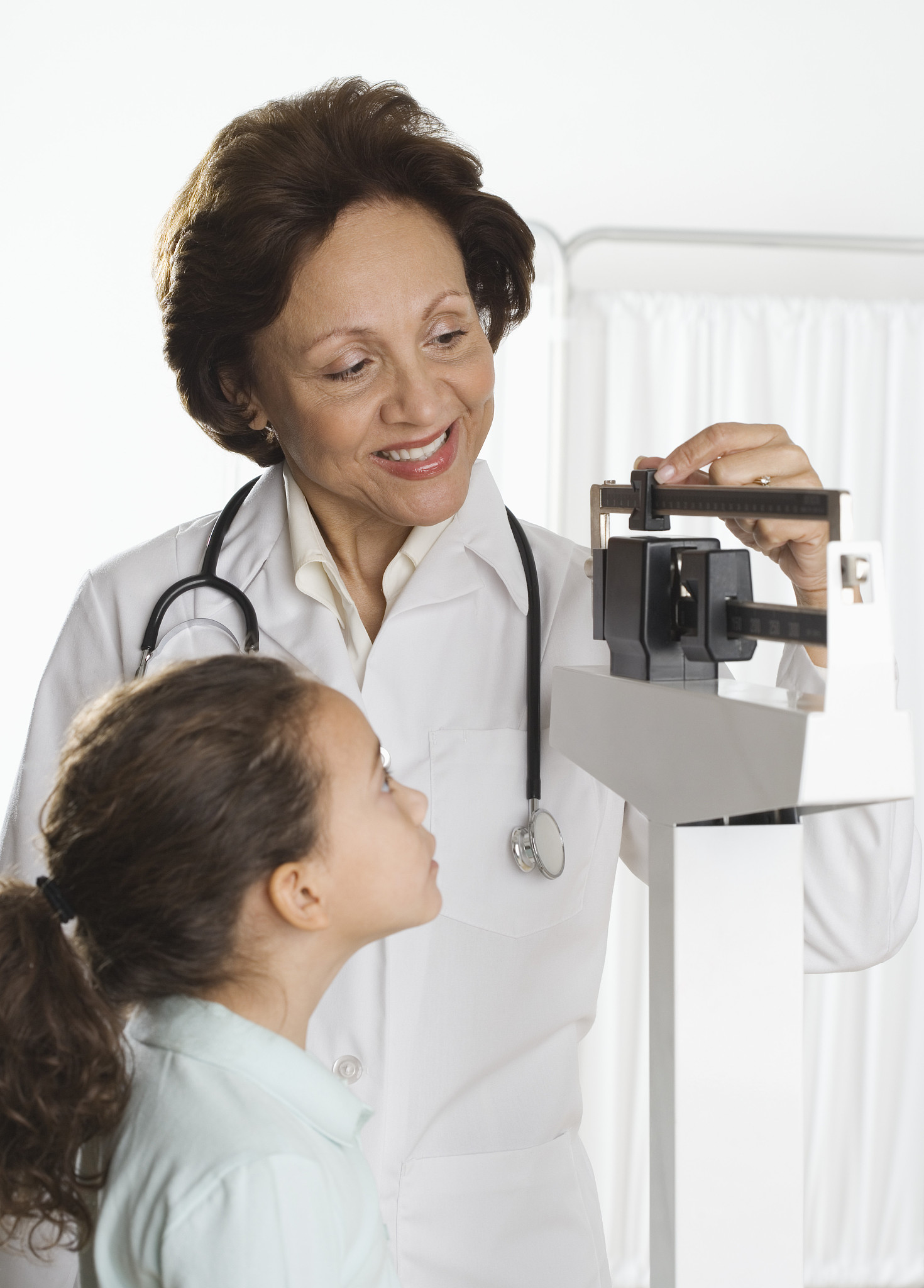 young girl being weighed at doctor's office
