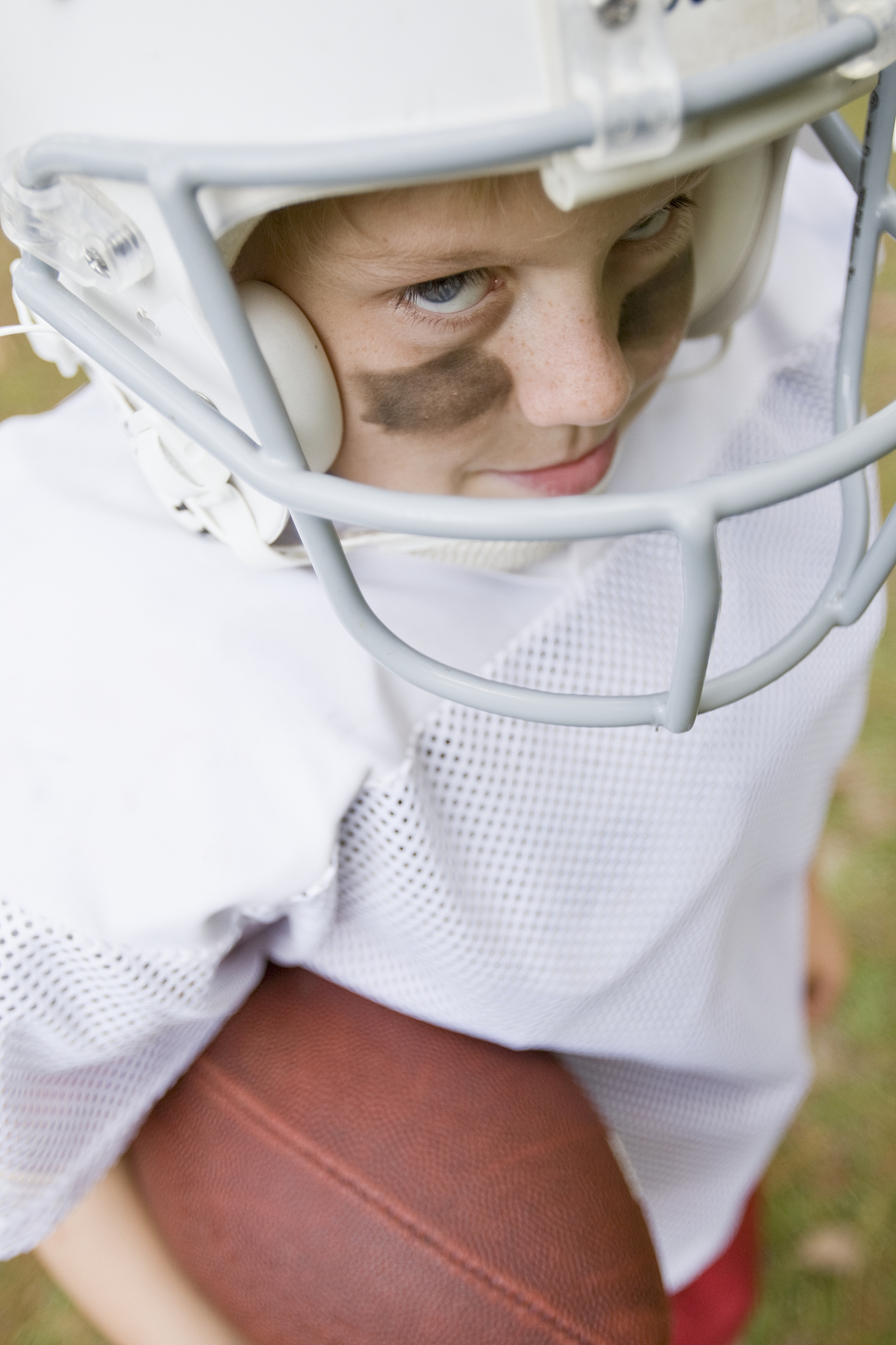 young boy in football uniform