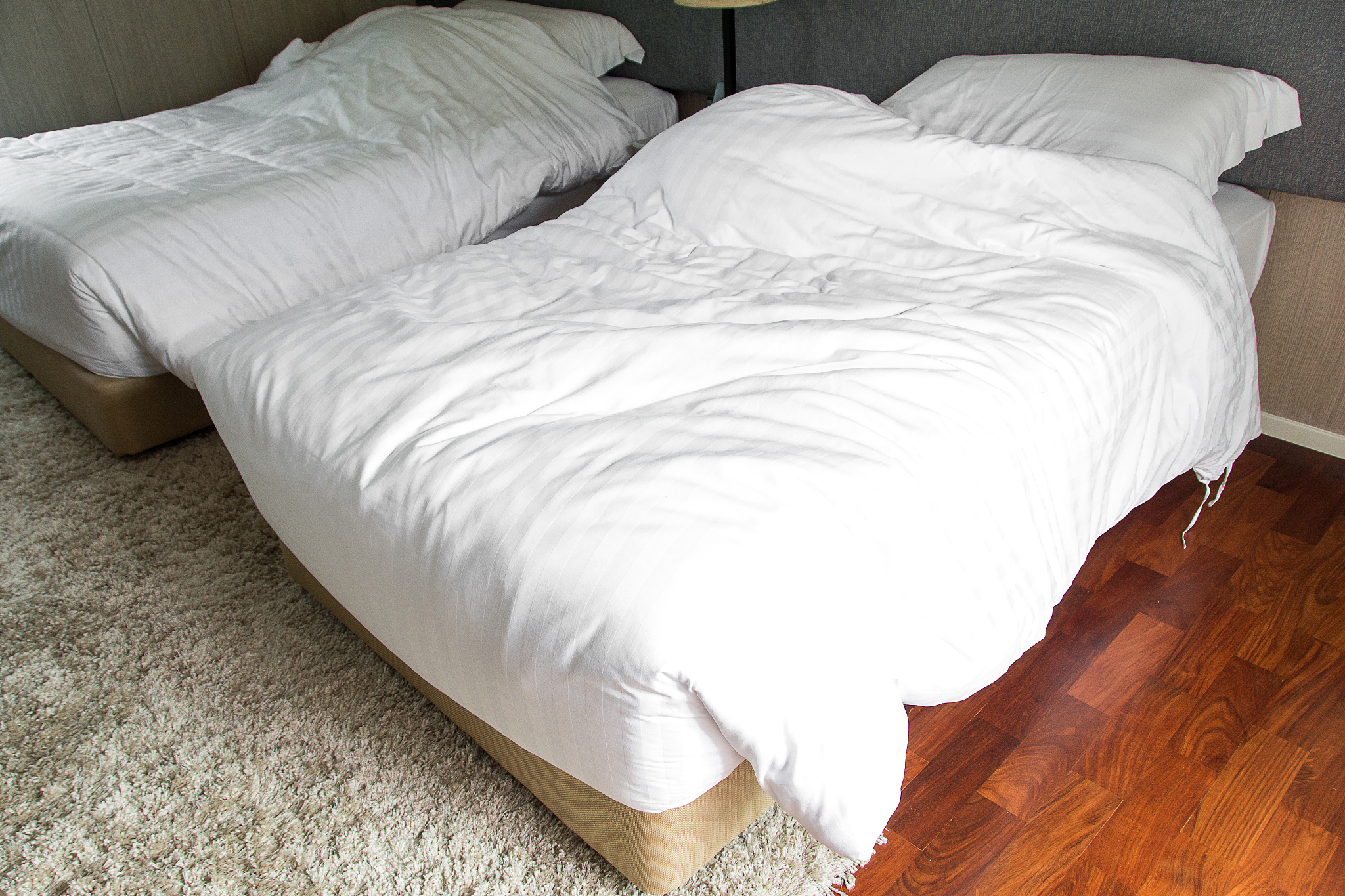 white bedding sheets and pillow