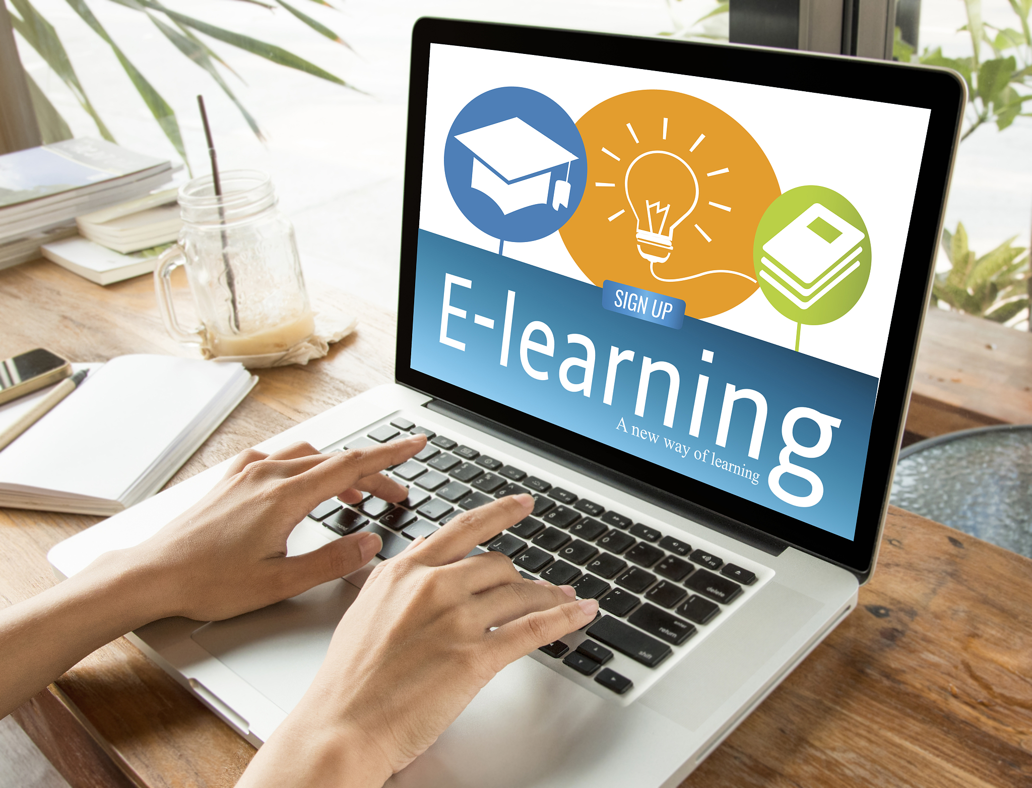 hand typing on computer keyboard with e-learning education on sc