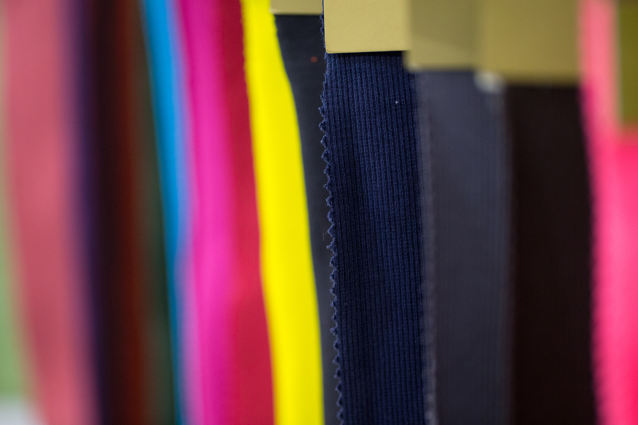 colorful fabric swatches in a shop