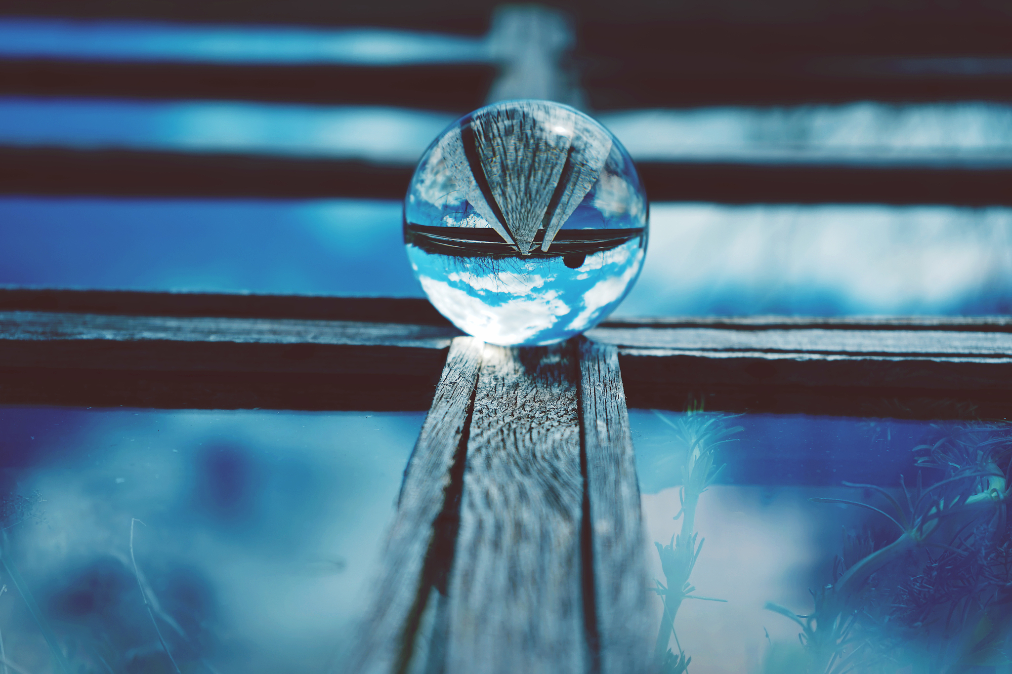 close-up of crystal ball on railing