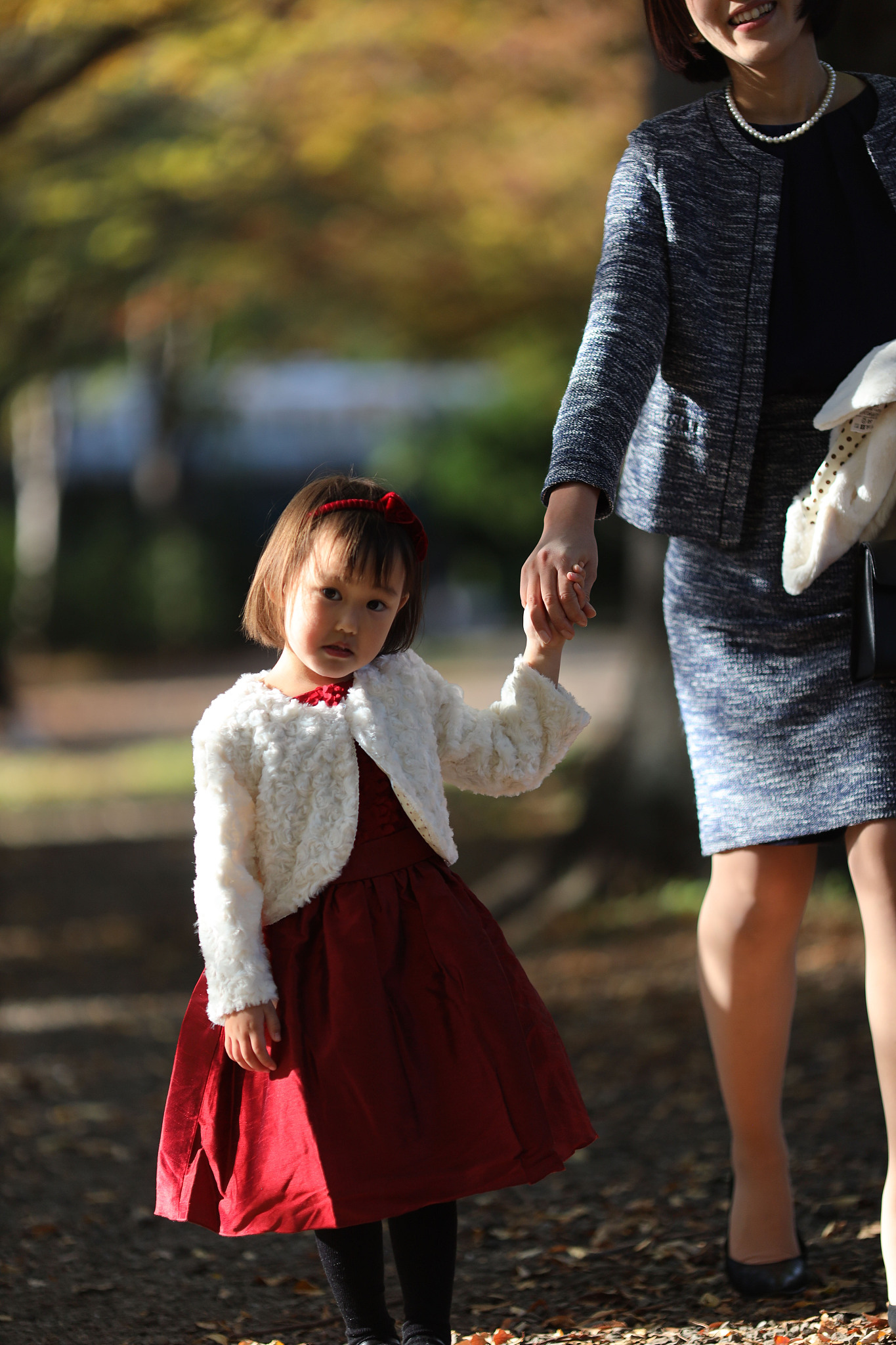 japanese mother walking  with her daughter at shichi go san cele