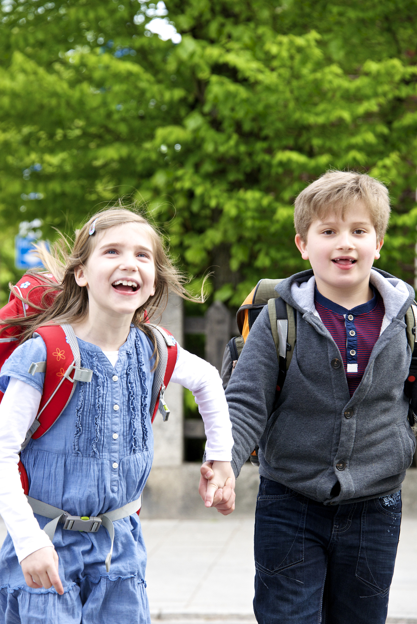 two children walking to school, munich, having fun, bavaria, ger