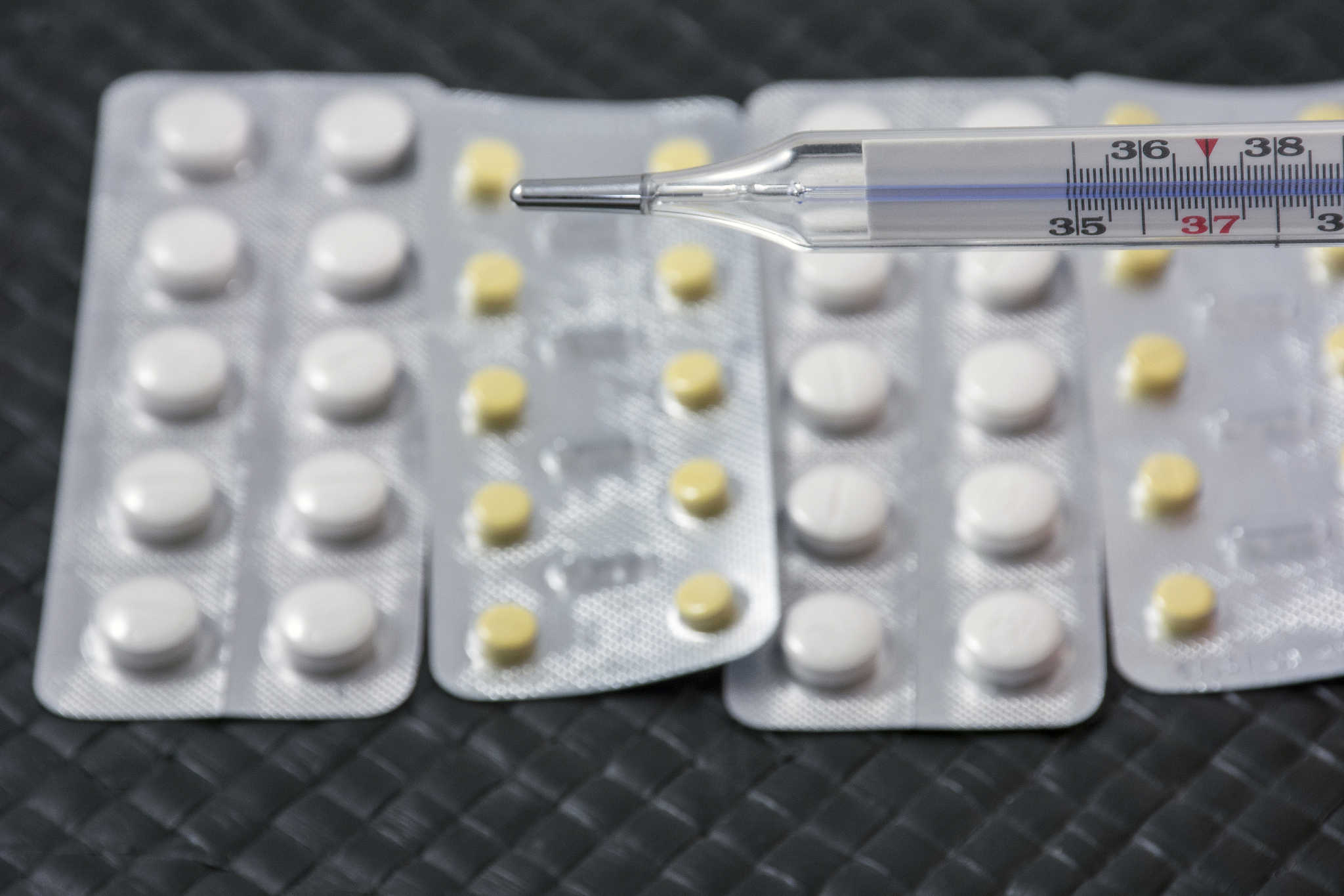 one thermometer with pills
