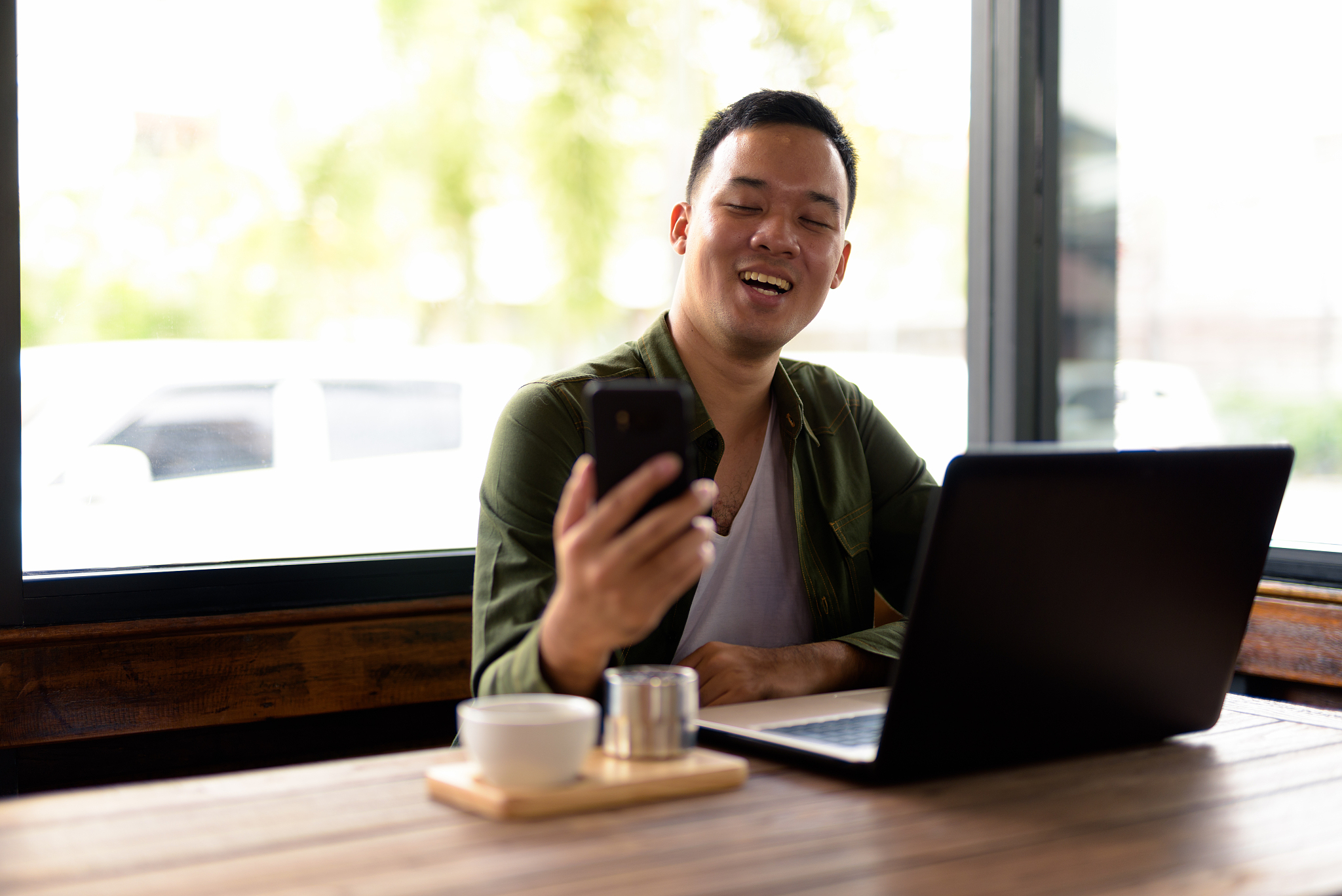 portrait of young asian man in coffee shop