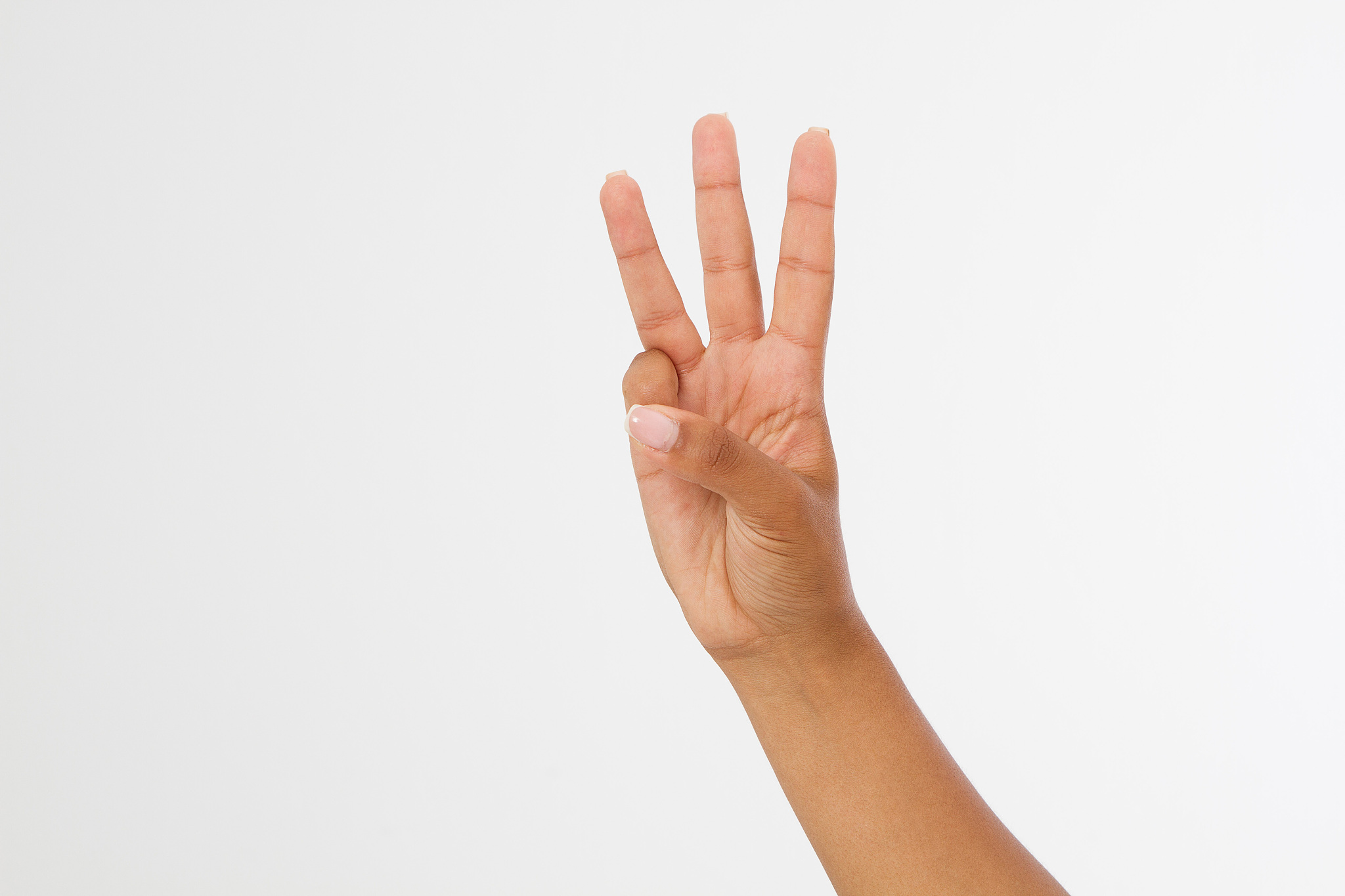 right hand a black woman show the third, number three sign. isol