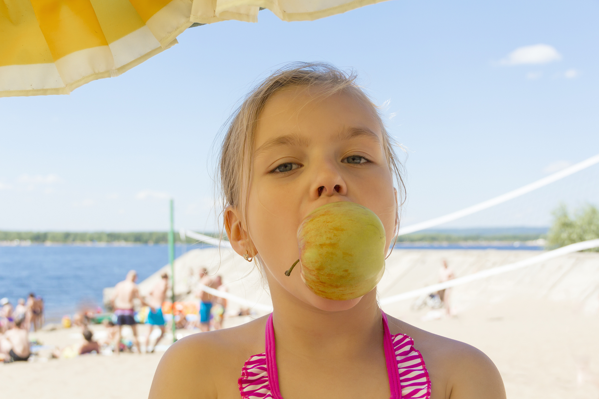 cute girl biting an apple