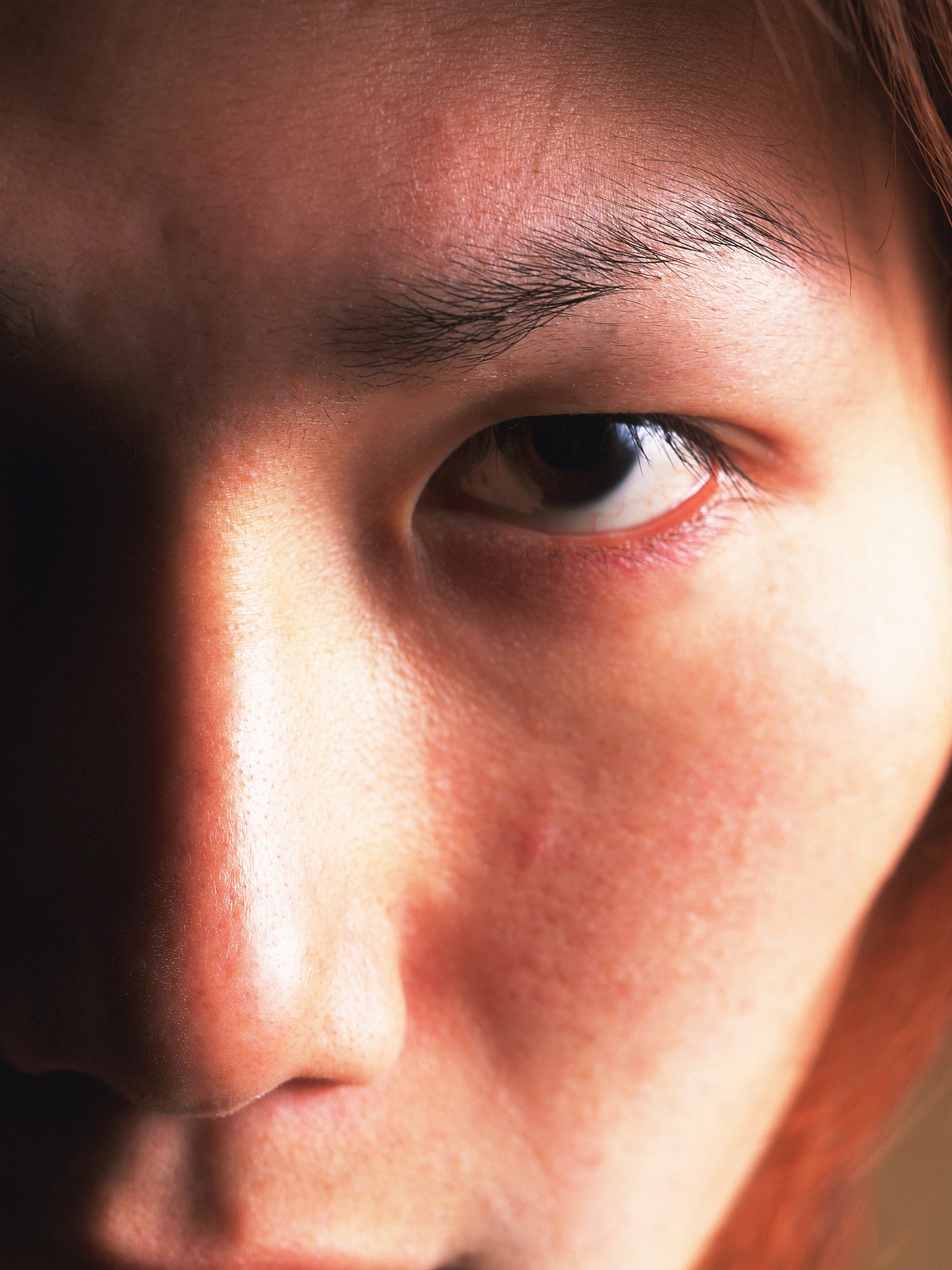 young adult man staring, close up, portraint
