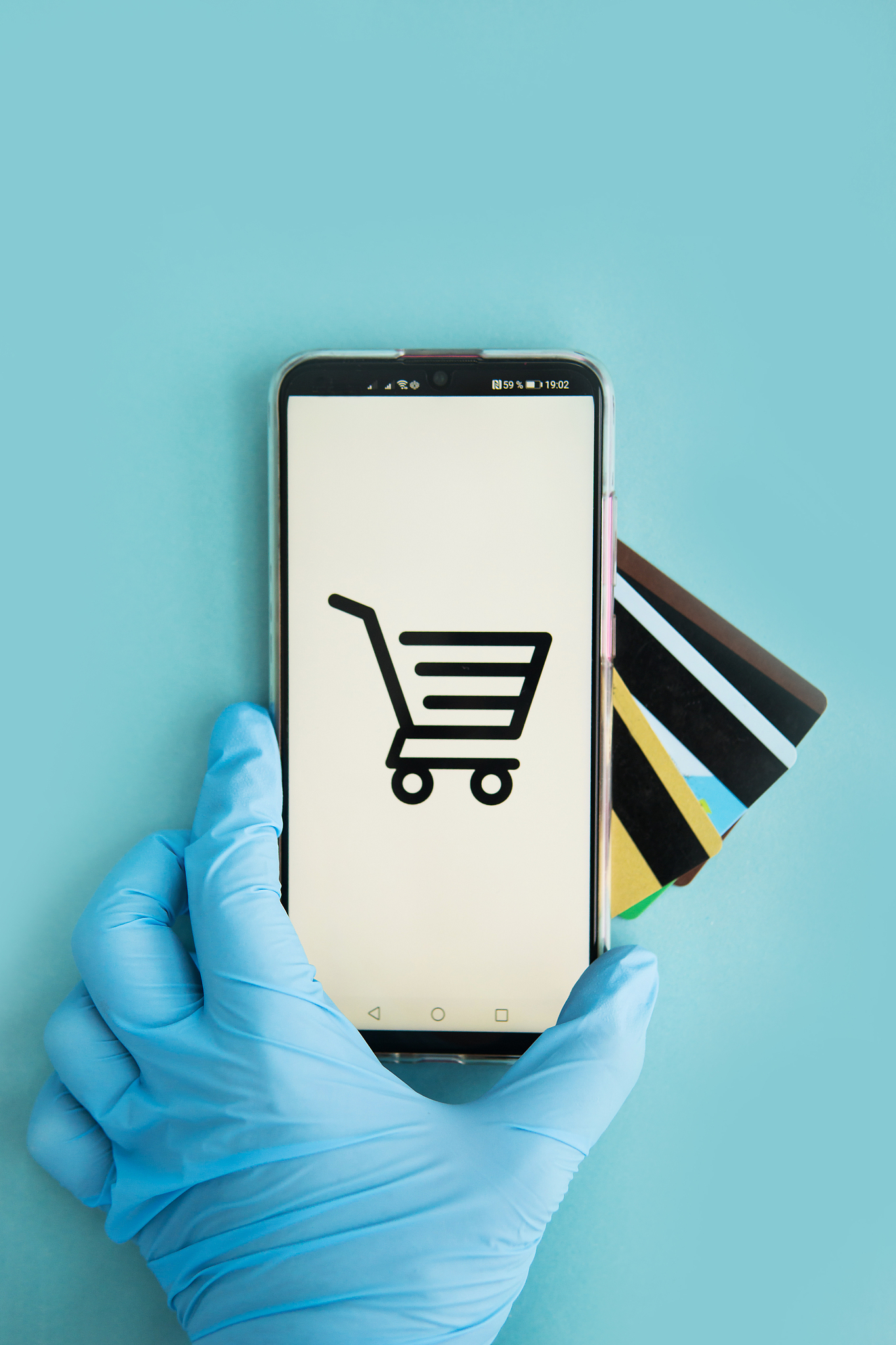 close-up of hands in medical gloves with a smartphone. online sh