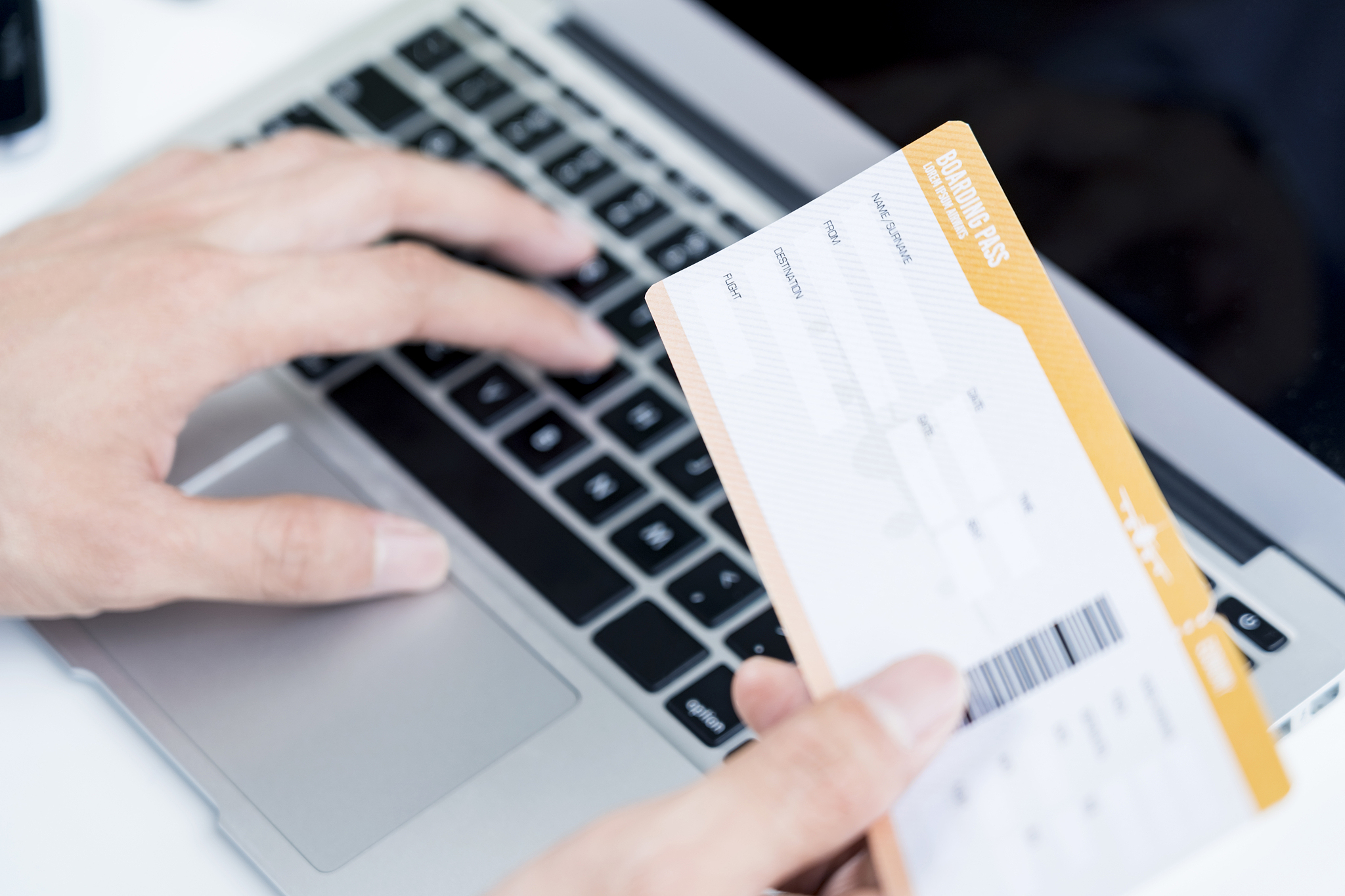 man with boarding pass doing an online check in