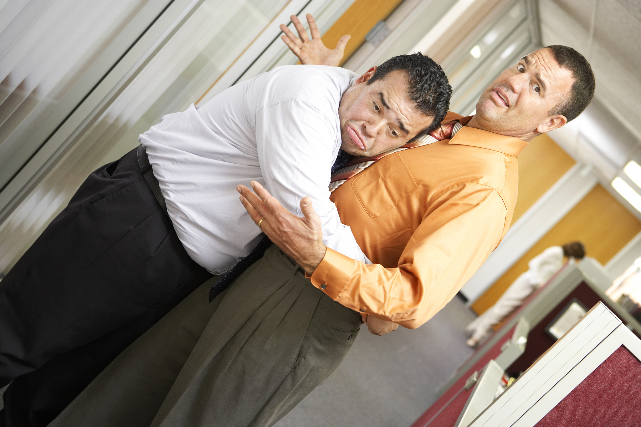 businessman hugging another businessman