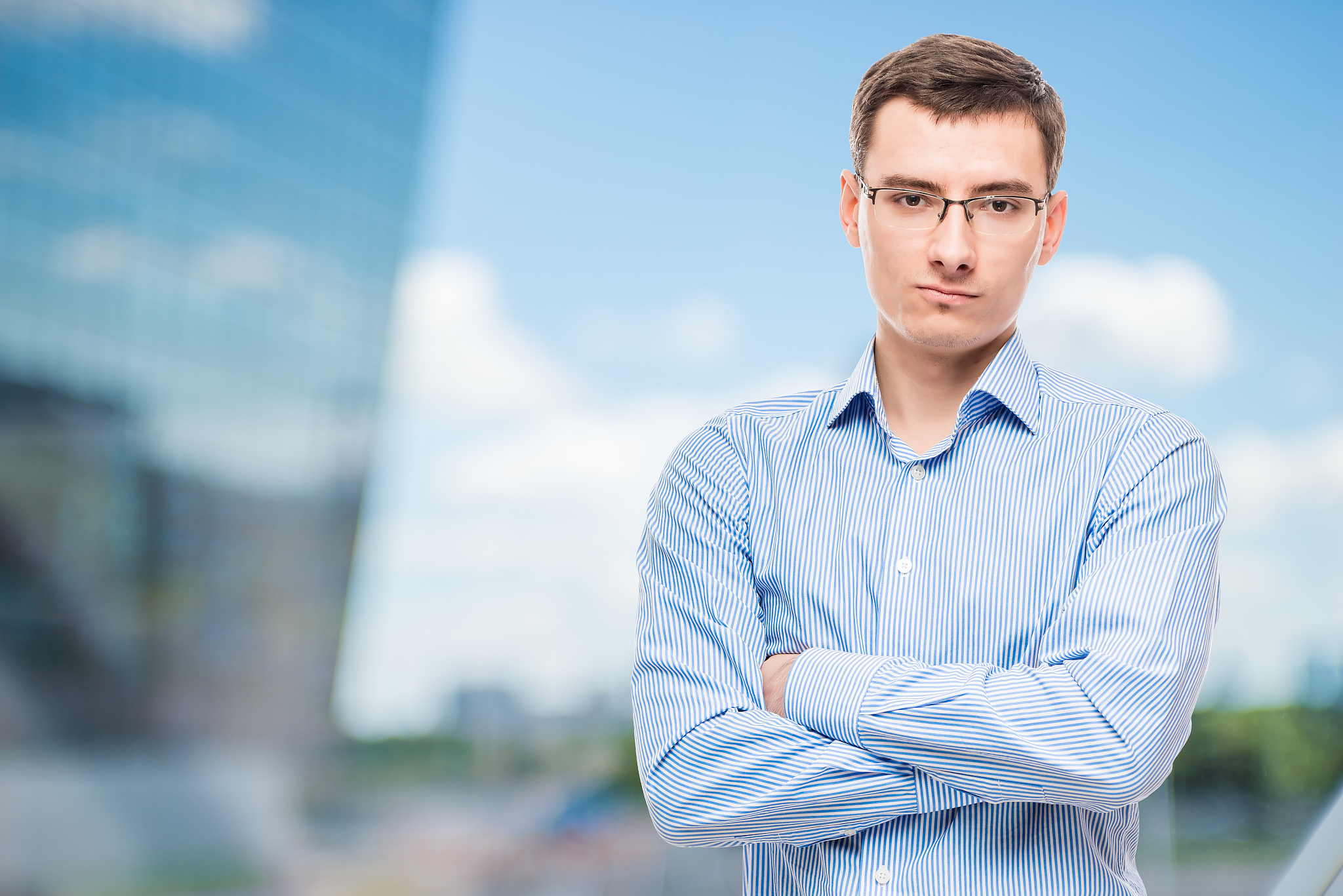 businessman in glasses young and very successful,  in office