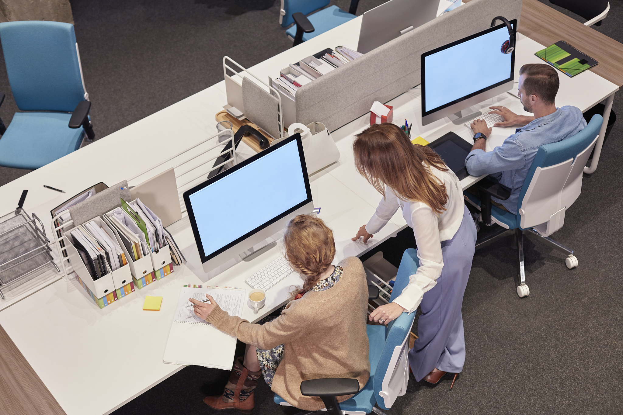 people working in big modern office