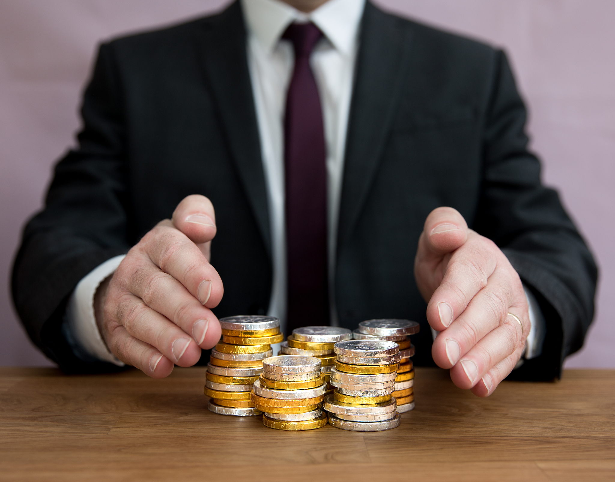 a businessman protecting money, assets, profits or claiming weal