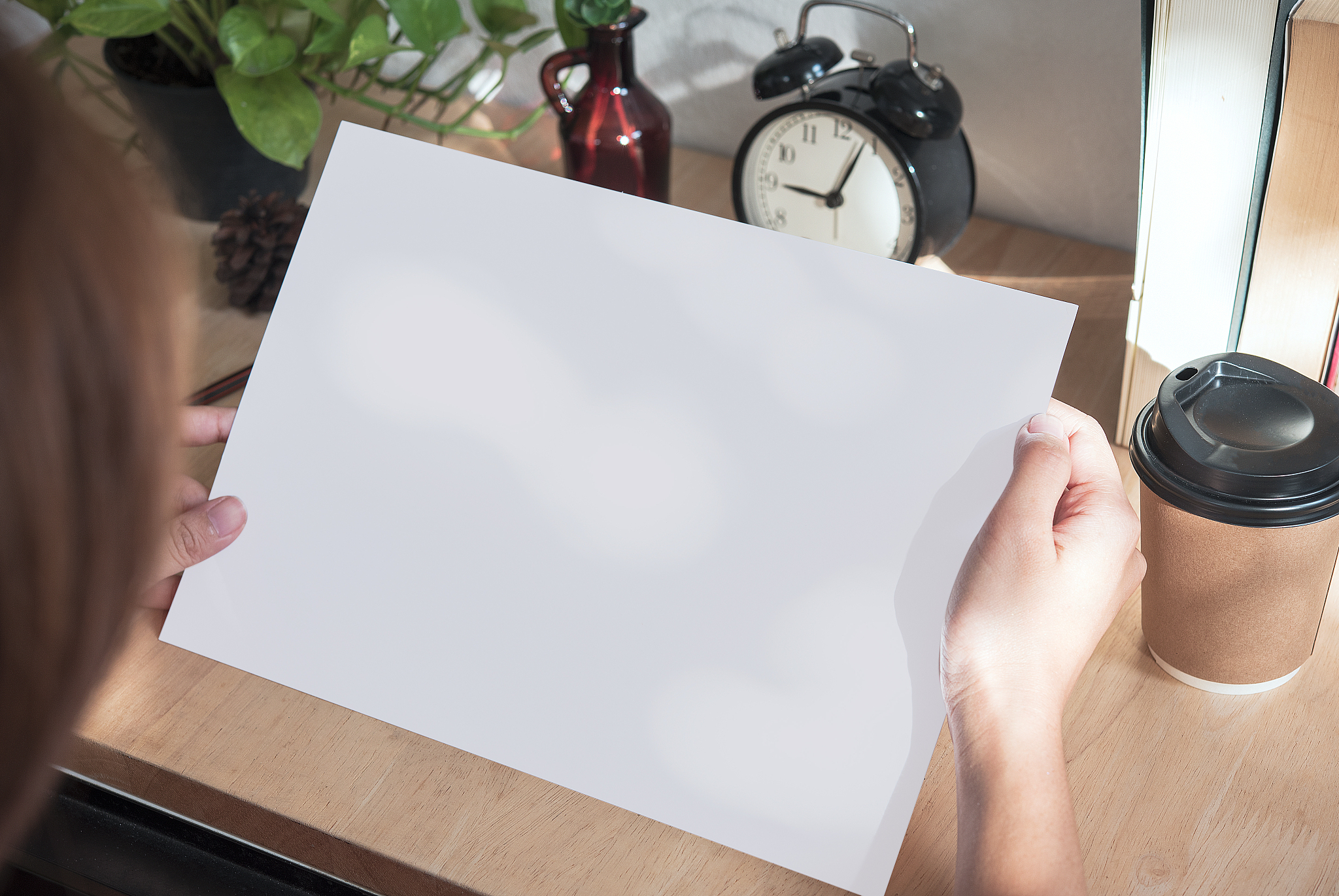 hand showing blank paper a4 flyer for mockup template design log