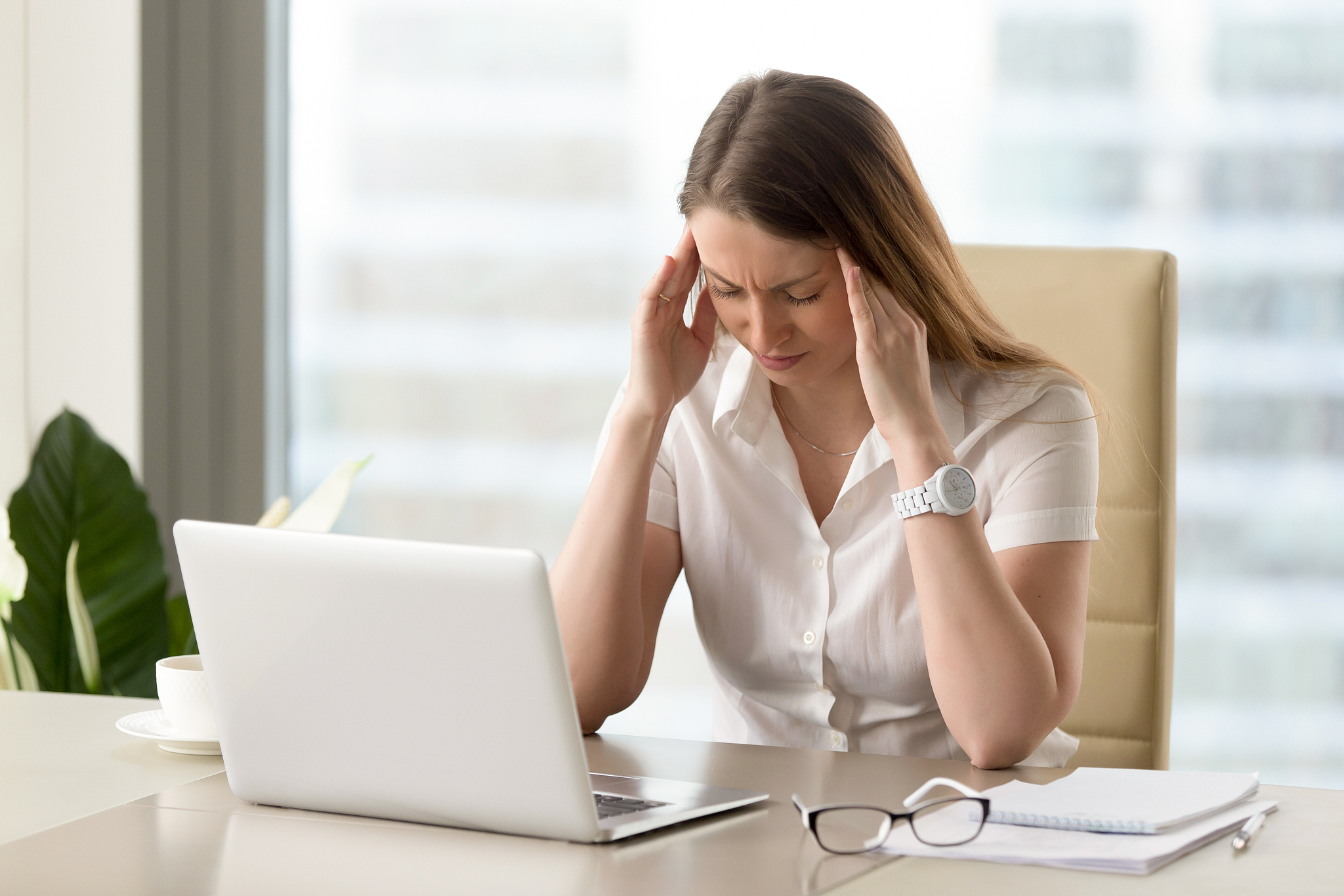 businesswoman under physical tension at work