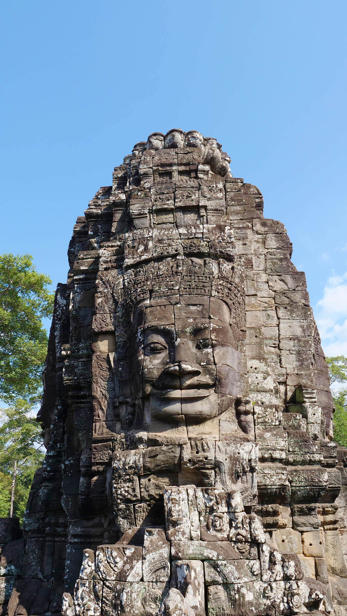 face tower at the bayon temple in angkor wat complex, siem reap 