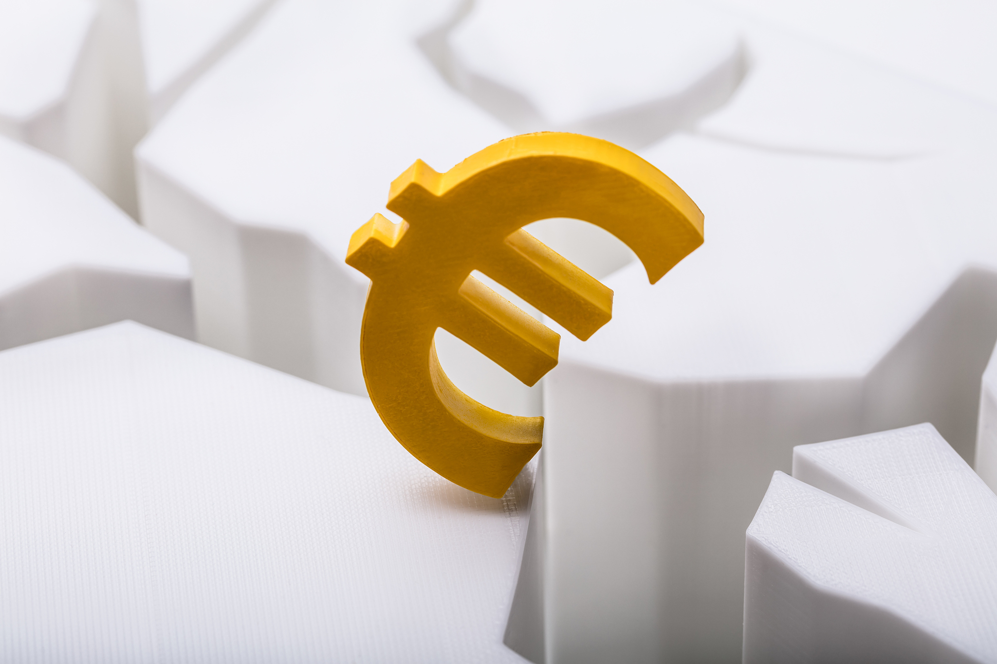 euro currency symbol on cracked white surface