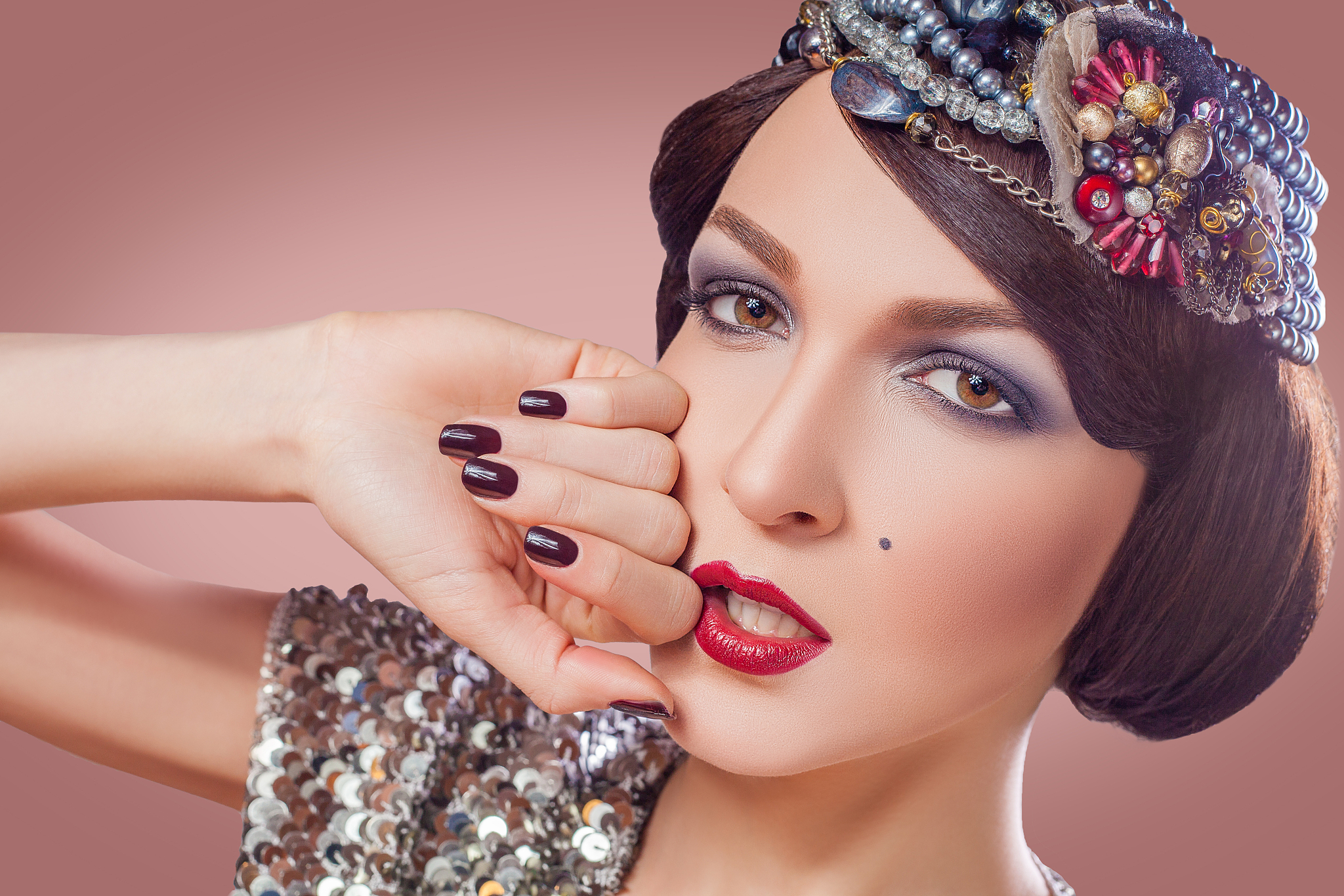 retro styled fashion portrait of a young woman with pearls.