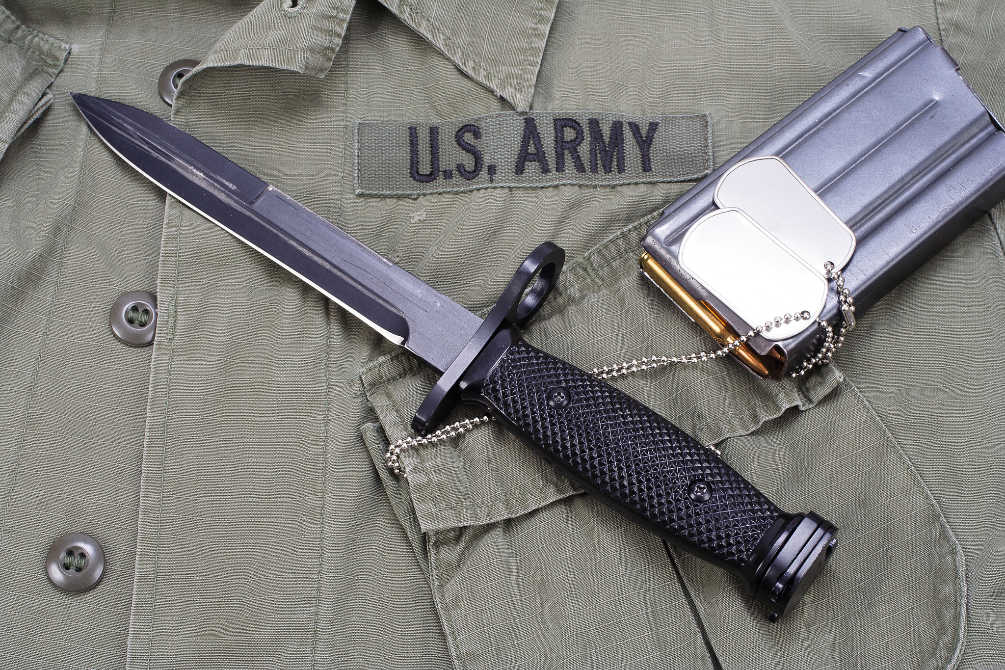 m16 rifle bayonet on uniform background