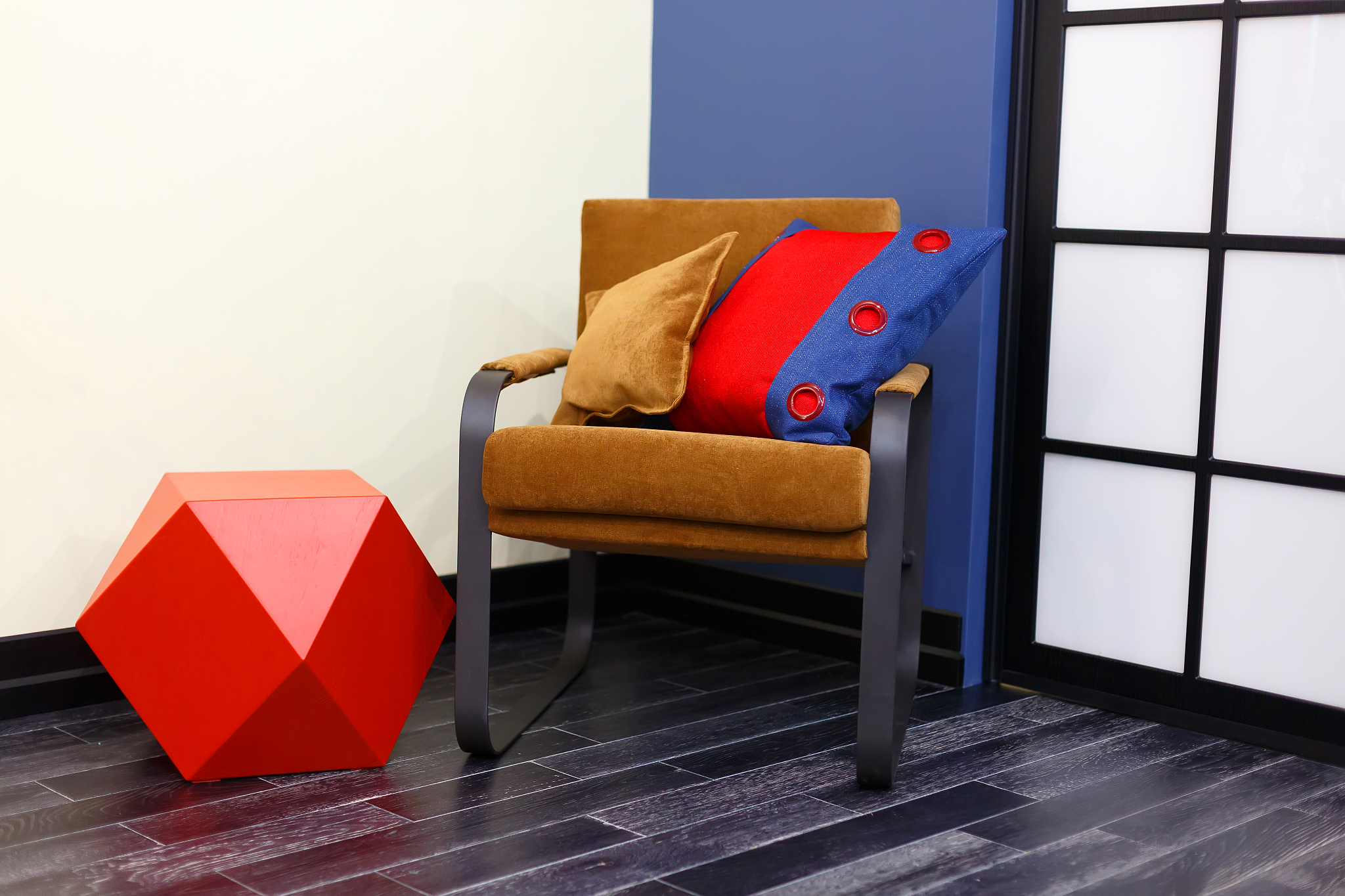 a brown chair with two pillows. bright tones of the children's r