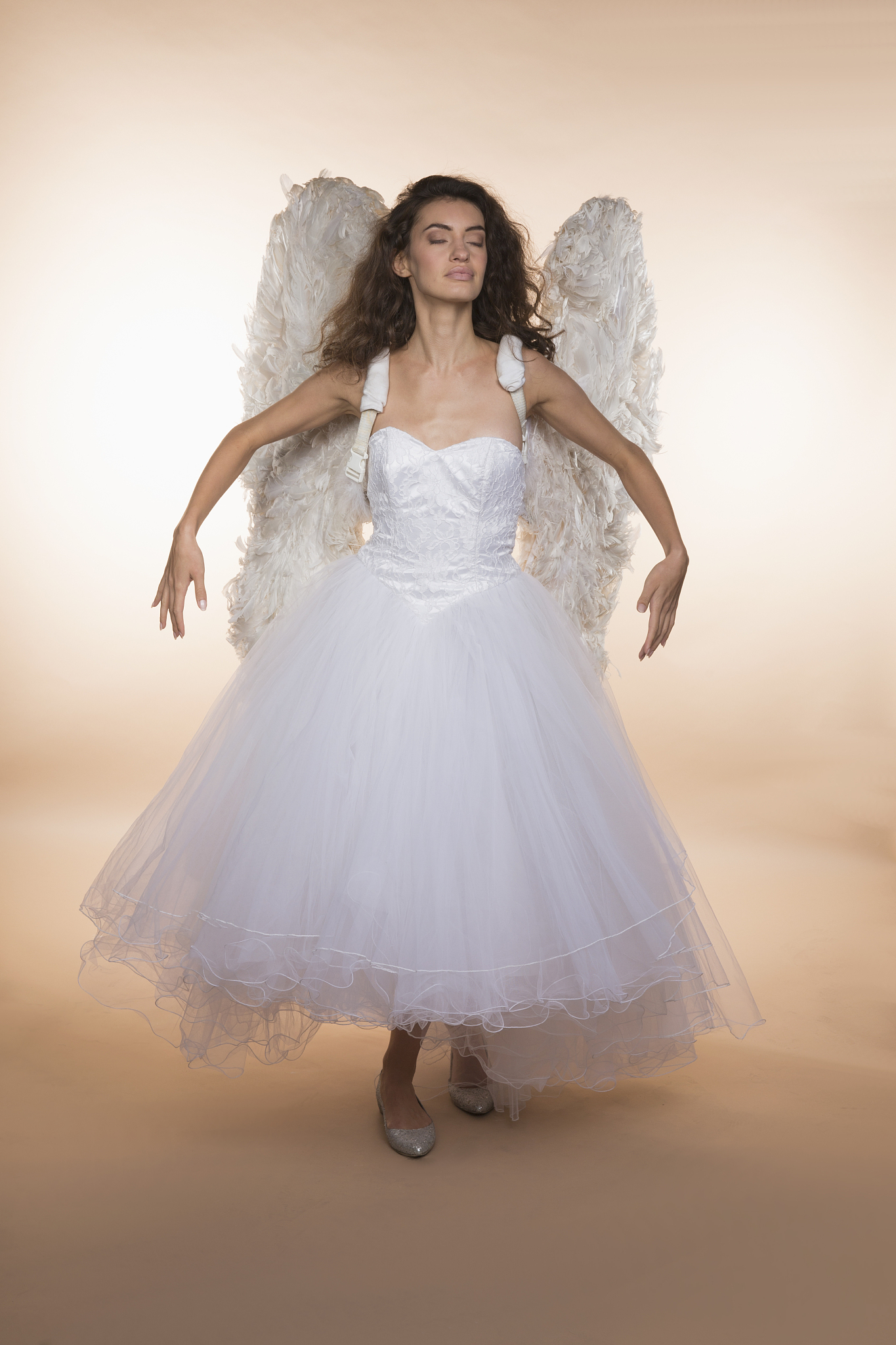 Cinematic Angel: Dark Hair, White Dress, & Golden Jewels
