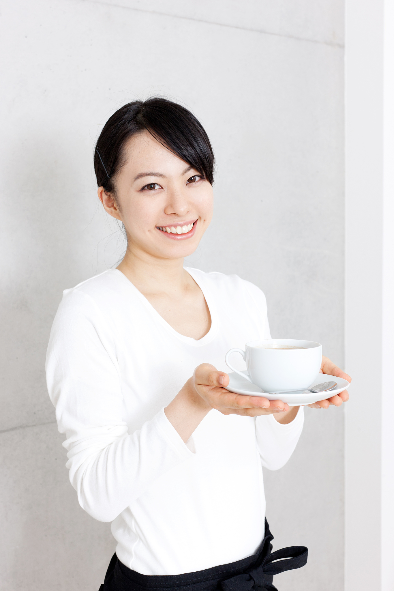 japanese woman holding a cup of tea