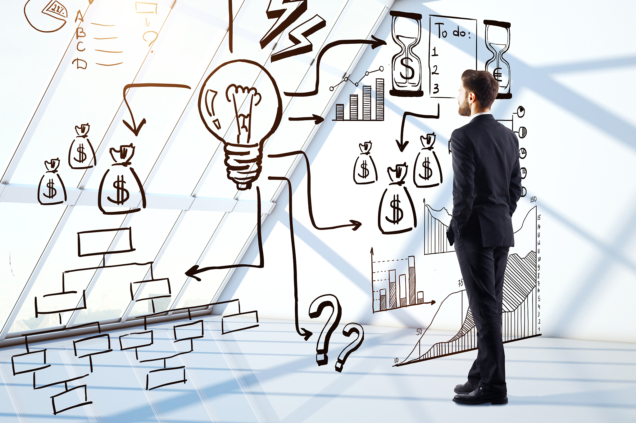 businessman looking at business sketch