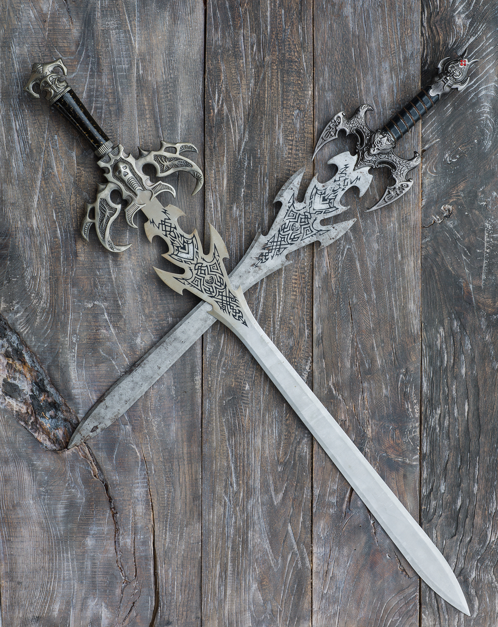 ancient swords on a wooden background