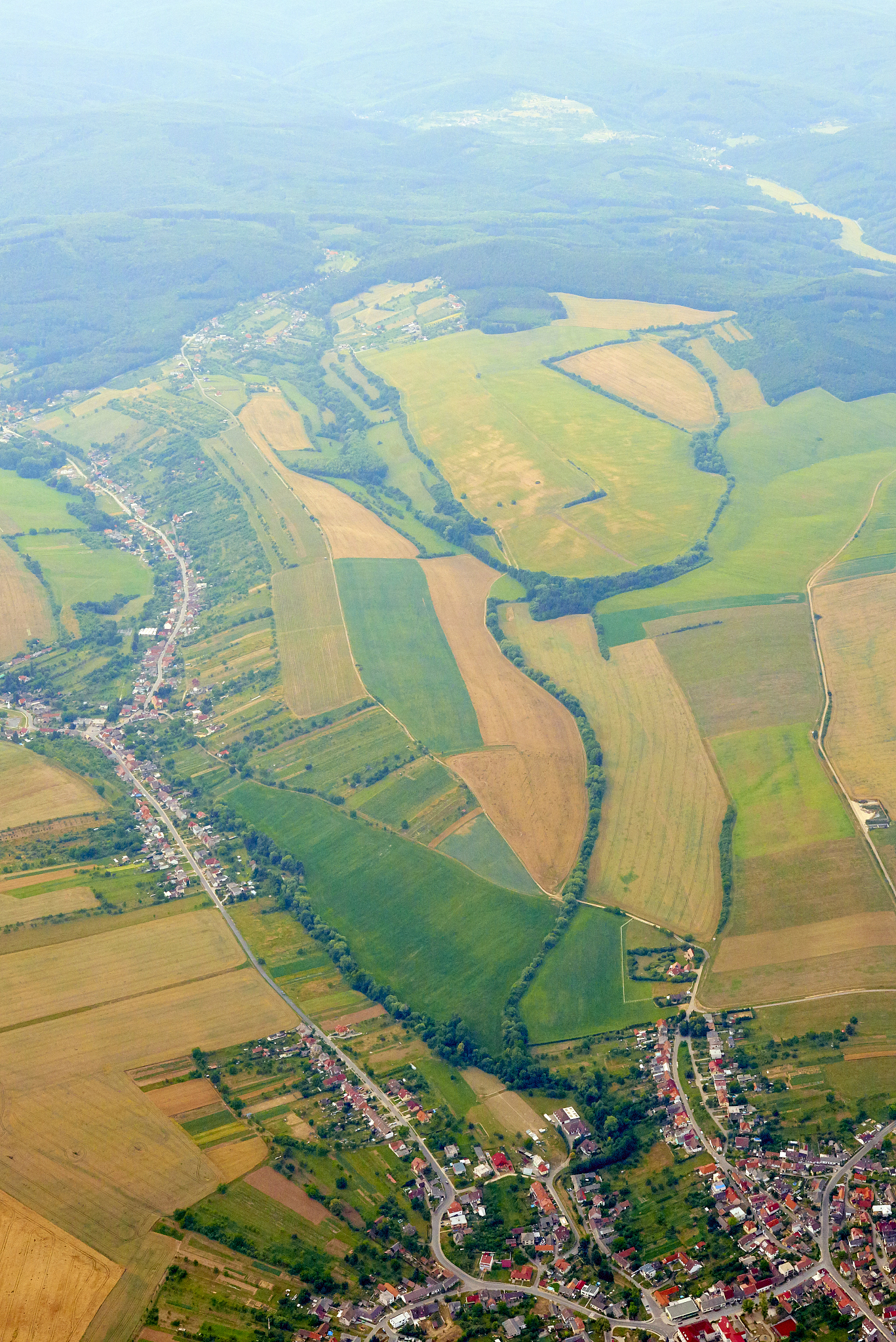 aerial view of unidentified village in summer countryside during