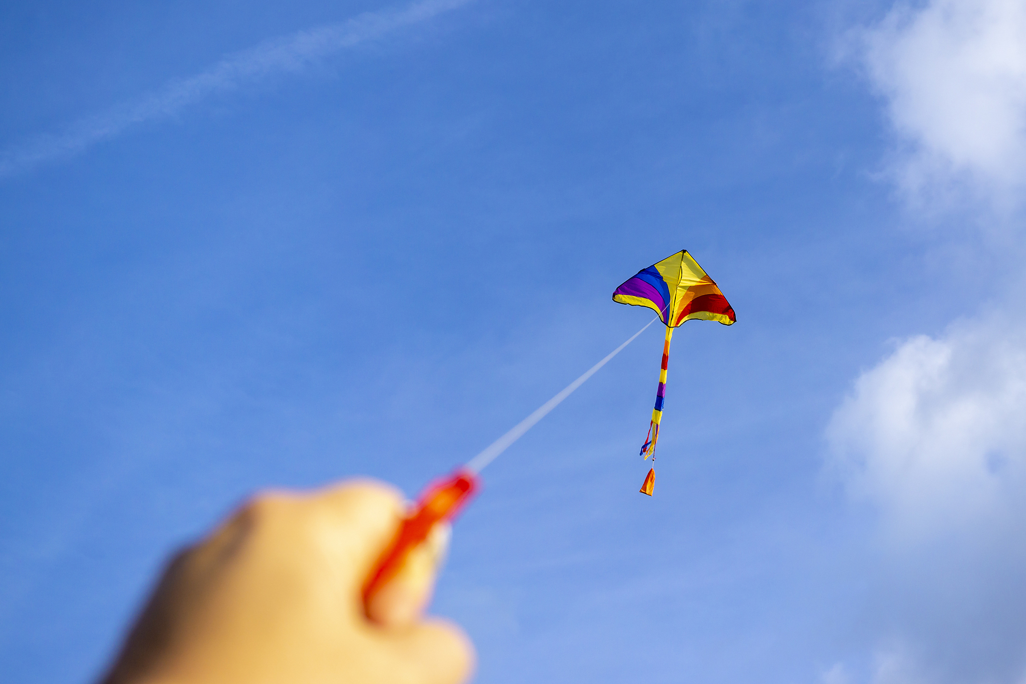 kite flying in a beautiful sky clouds.