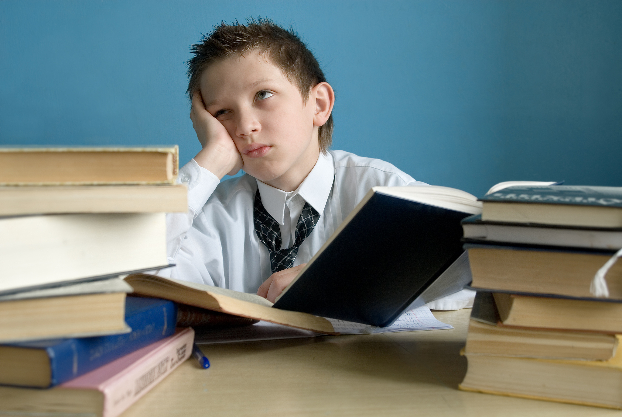 young schoolboy doing his homework