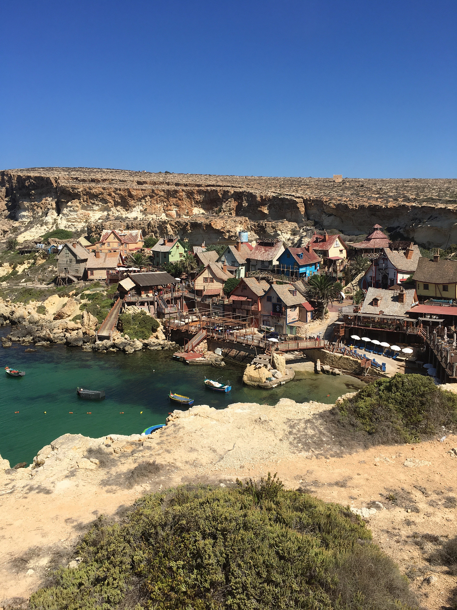 view of town against clear blue sky