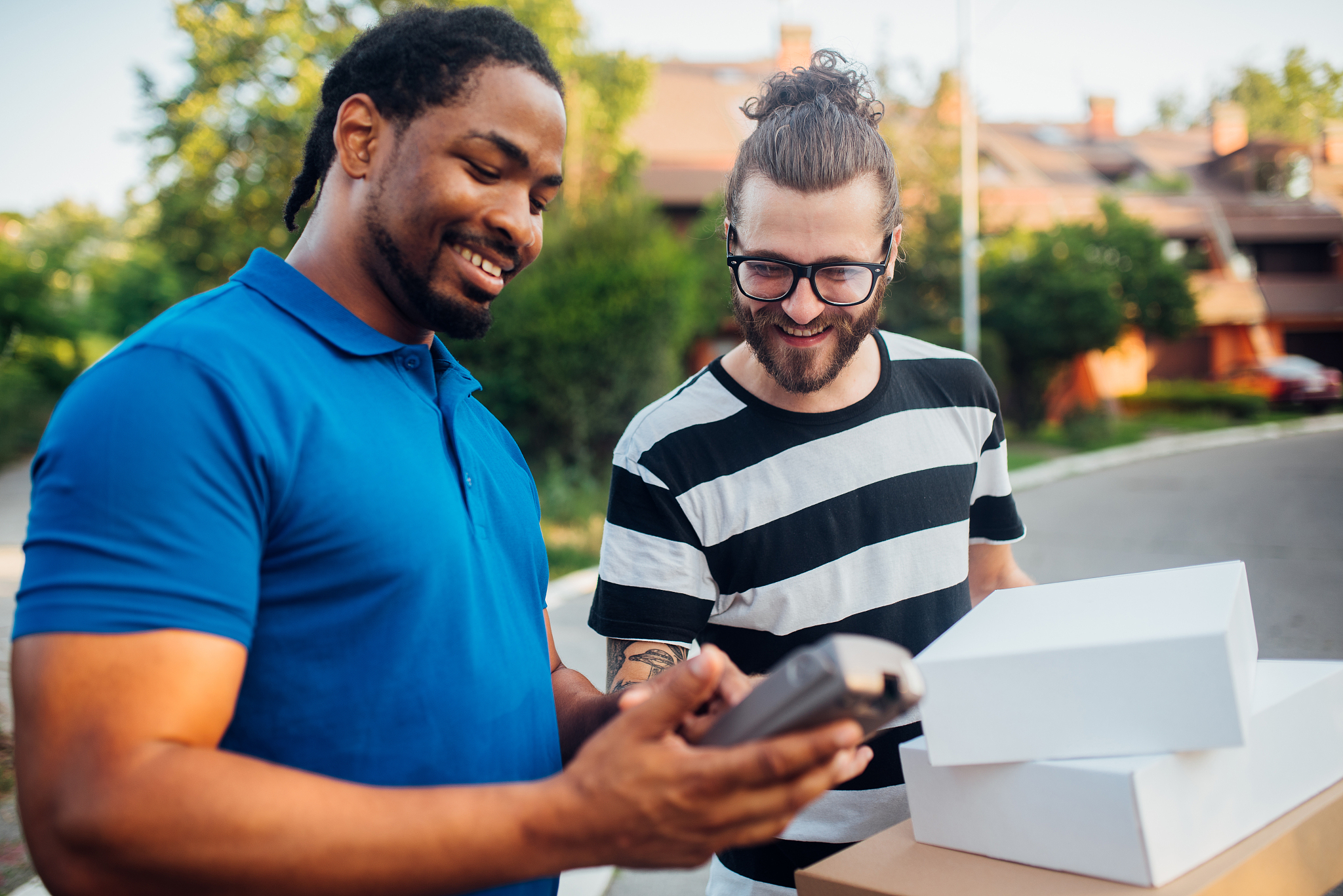 cheerful man paying delivery with credit card