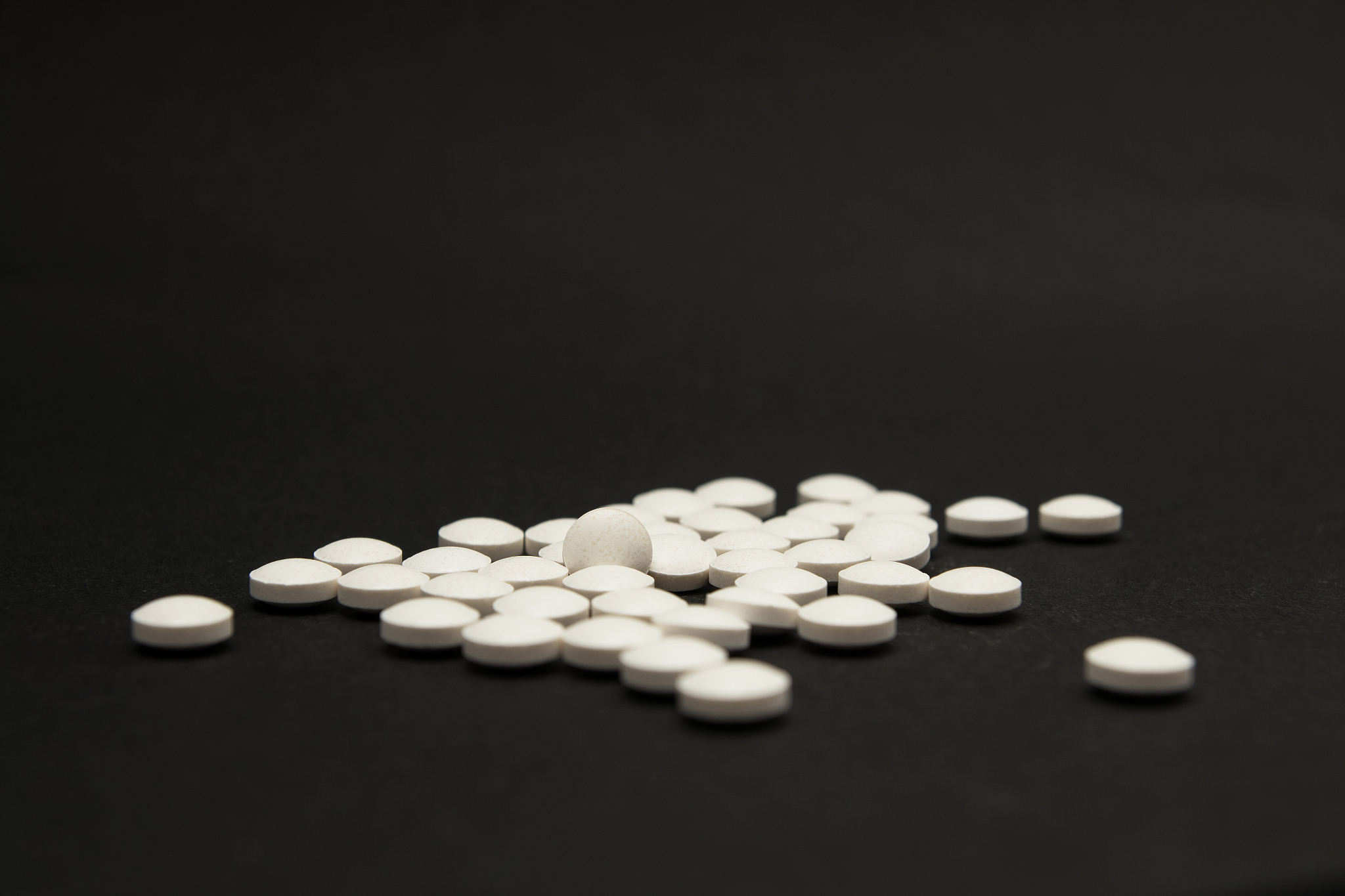 pills on black background