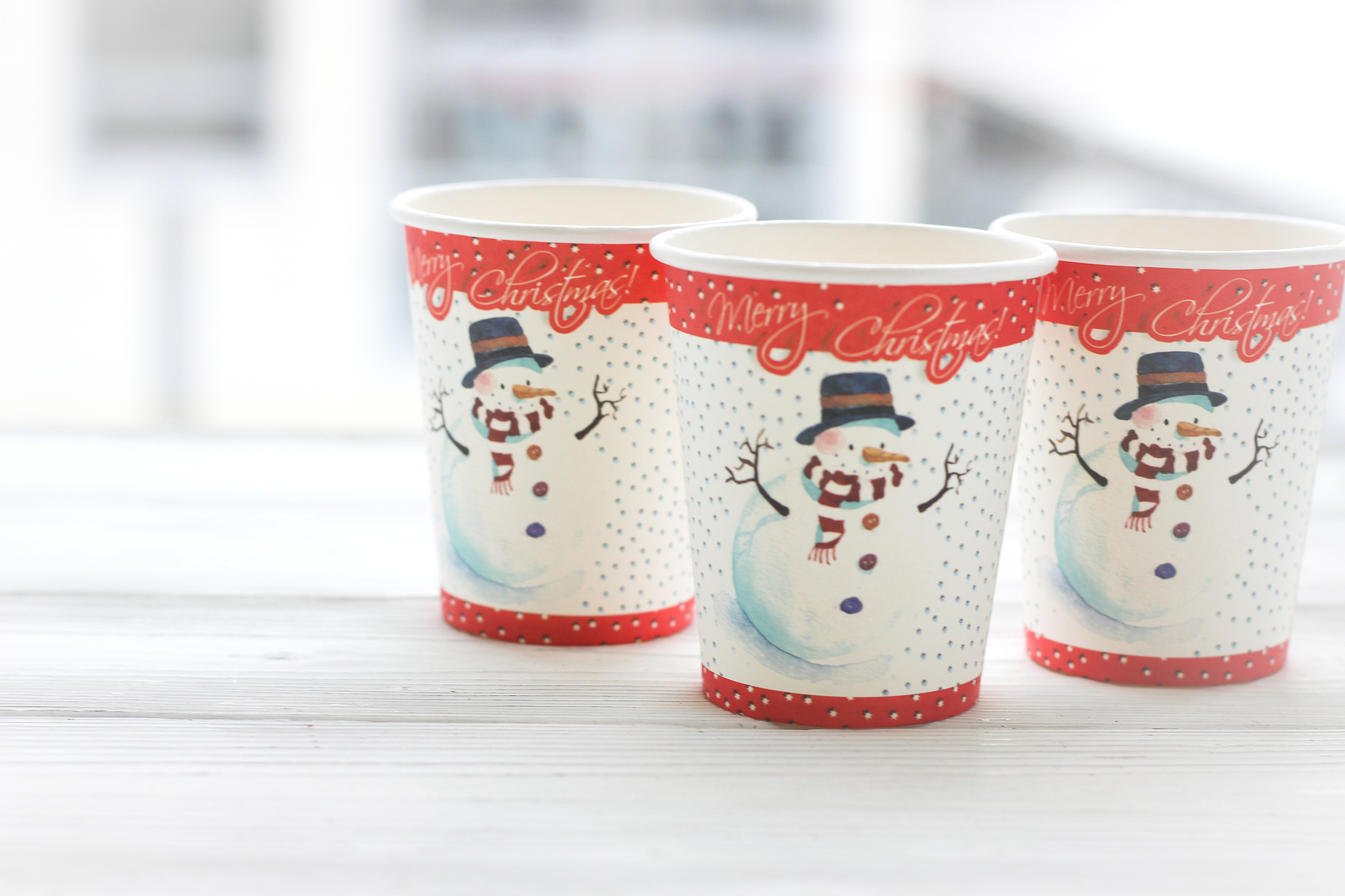 festive still life: three glasses with a picture of a snowman