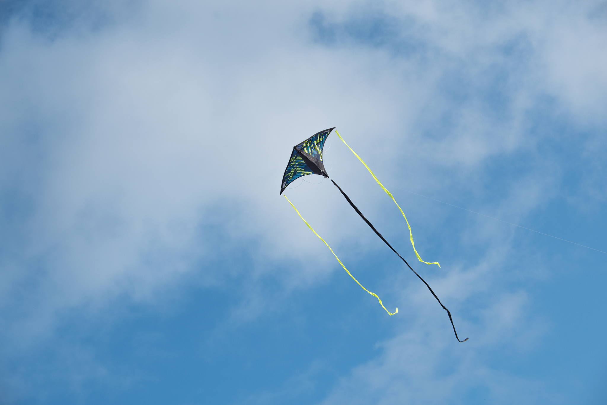 kite flying against the blue sky