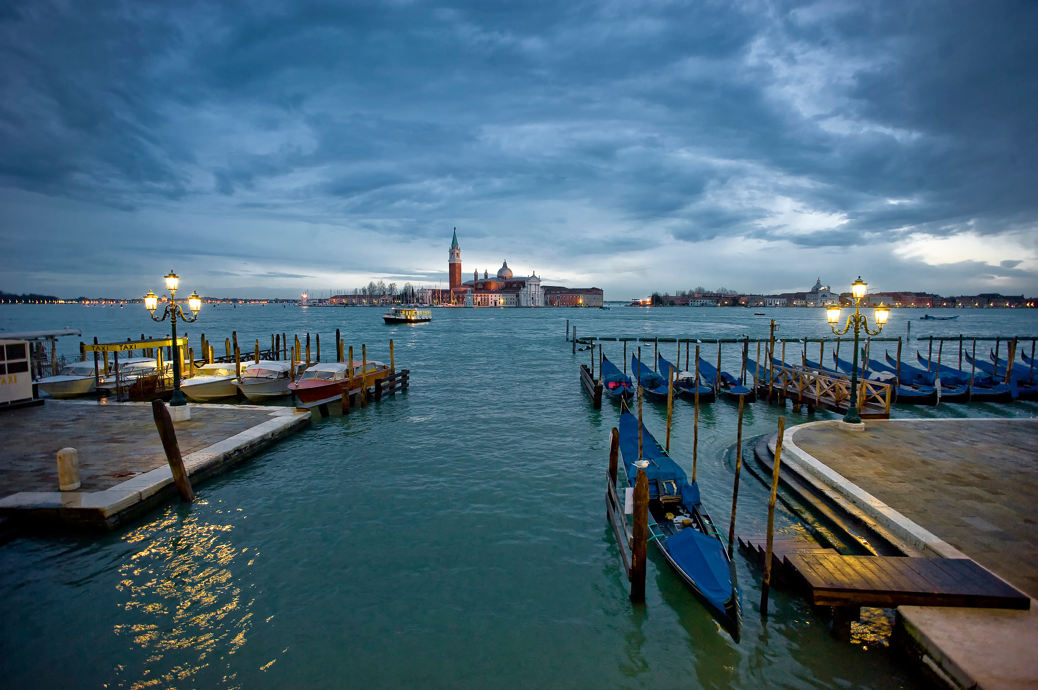 scenic view of grand canal against cloudy sky in city