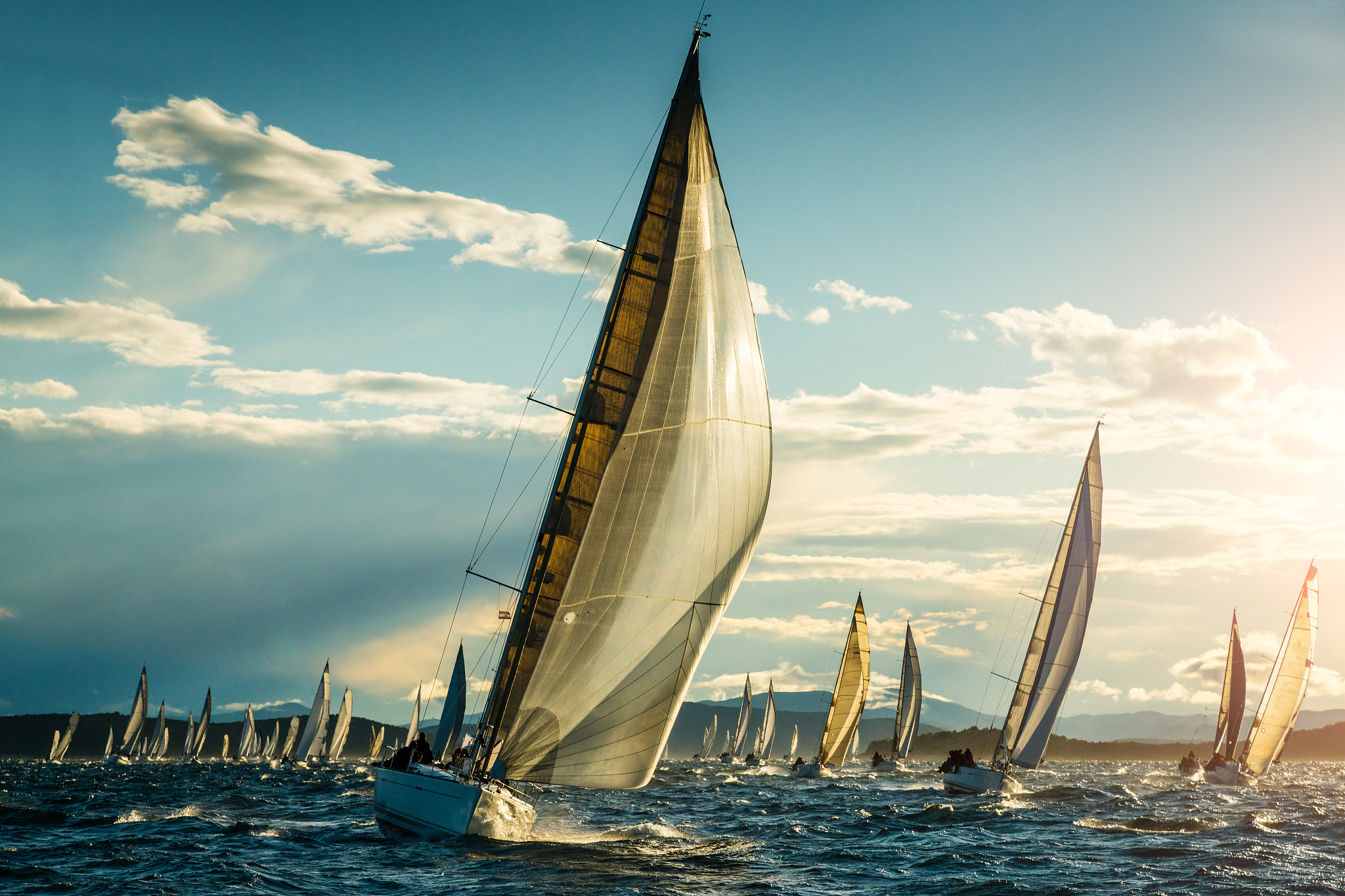 sailboat on regatta on sunny autumn morning